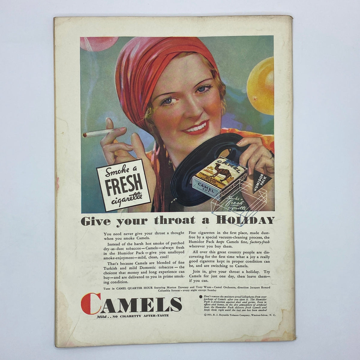 Vintage advertisement for Camels cigarettes featuring a woman holding a cigarette and a tin of Camels, with the text 'Give your throat a HOLIDAY'. This ad illustrates the charm of early 20th-century advertising, complementing the title 'The New Yorker Complete Magazine October 31, 1931 Helen E. Hokinson Cover'.