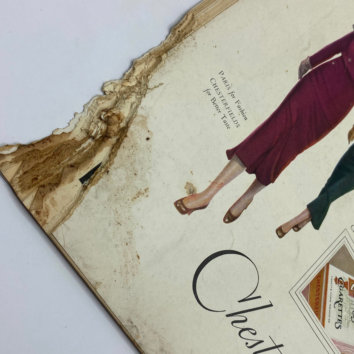Close-up image of a damaged page corner from the Chesterfield advertisement in The New Yorker Complete Magazine October 15, 1932 William Steig Cover, demonstrating the magazine's aged condition.