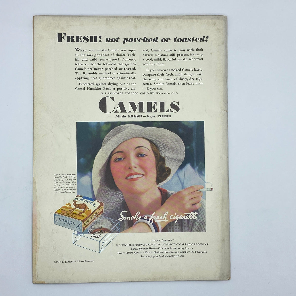 Back cover advertisement for Camels cigarettes in The New Yorker Complete Magazine June 11, 1932, featuring a woman holding a cigarette and promoting the freshness of Camel tobacco.