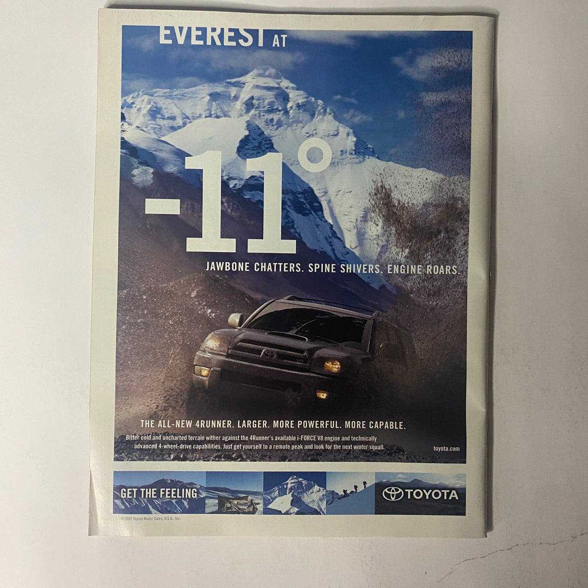 Advertisement from Sports Illustrated Magazine November 11, 2002, promoting Toyota's new vehicle in harsh conditions, demonstrating durability and performance.