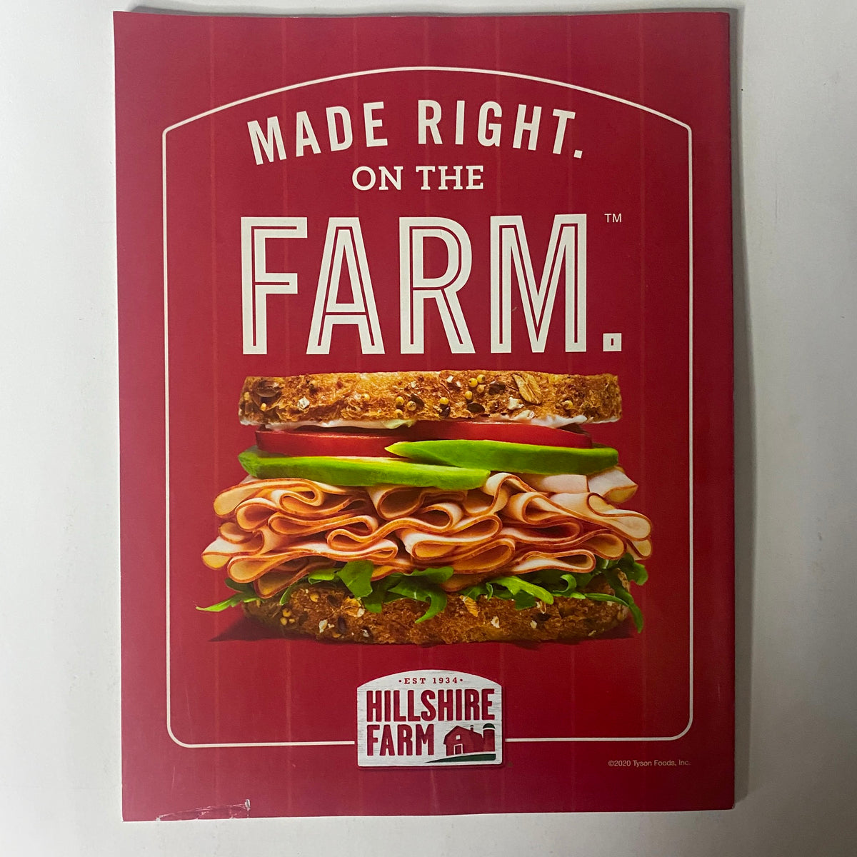 Sports Illustrated Magazine February 2023 showcasing a Hillshire Farm advertisement featuring a sandwich made with high-quality meat and fresh ingredients, emphasizing the brand's commitment to freshness with the slogan 'Made Right. On the Farm.'