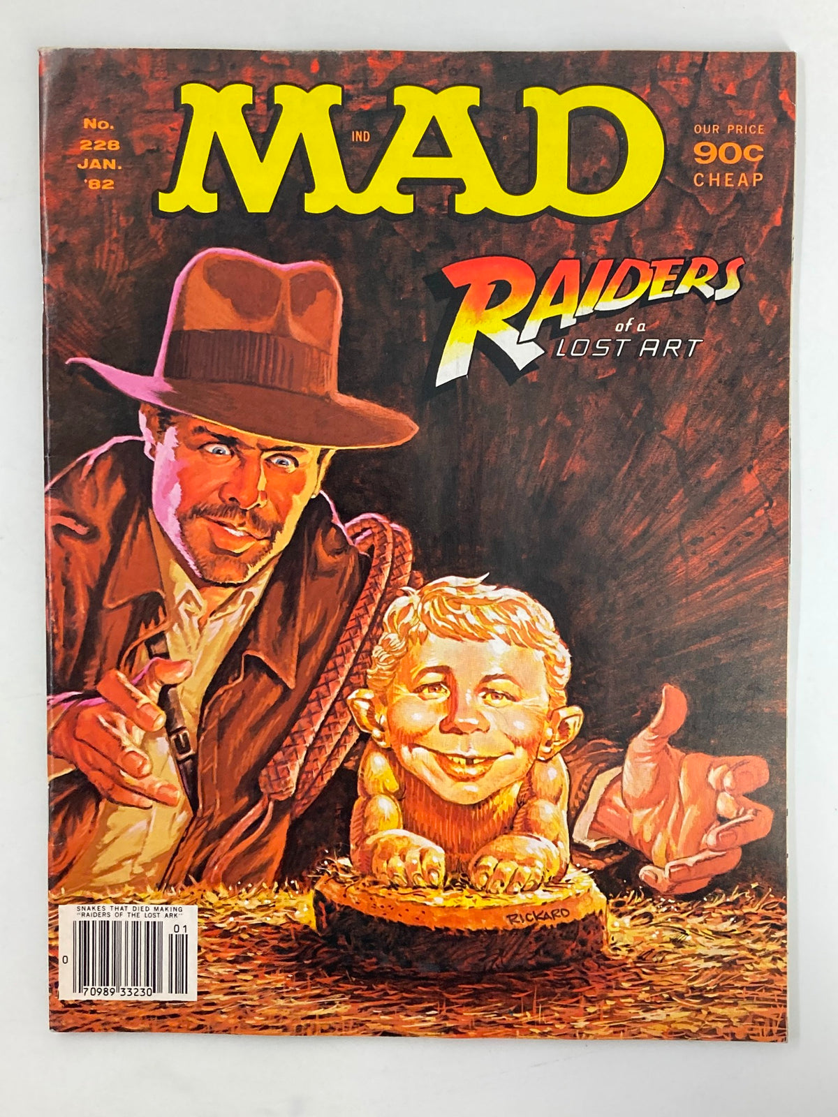 Cover of Mad Magazine January 1982 No. 228 featuring a parody of Indiana Jones with the title 'Raiders of Lost Art'. The cover showcases a humorous illustration depicting a character resembling Indiana Jones and a caricature of a baby.