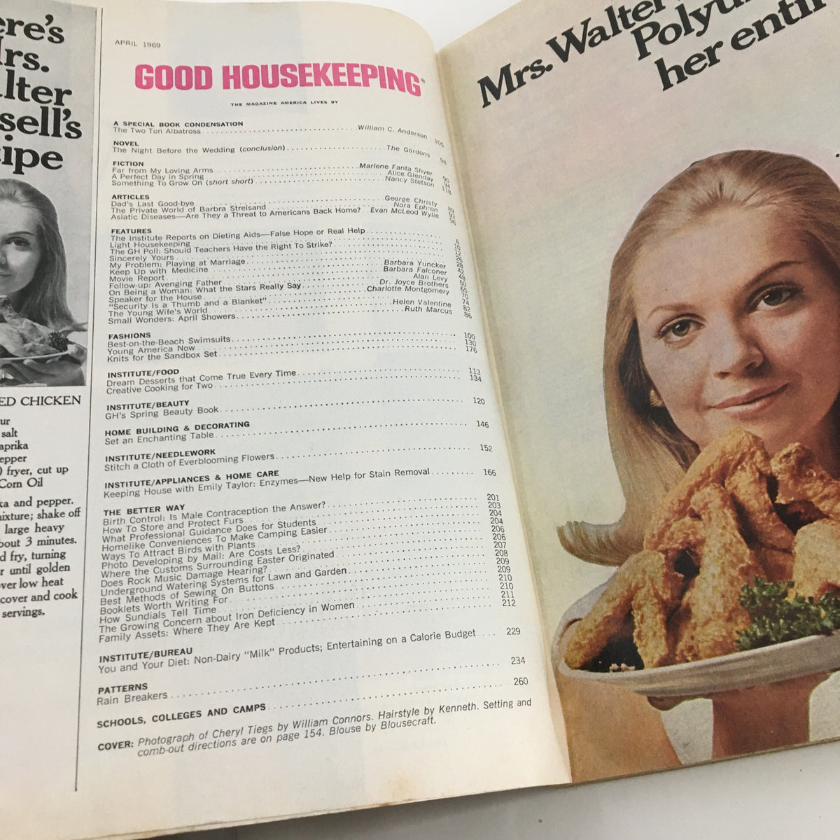 Interior page of Good Housekeeping Magazine April 1969, displaying the table of contents along with a photograph of a woman with a plate of food, capturing the essence of domestic lifestyle in the 1960s.