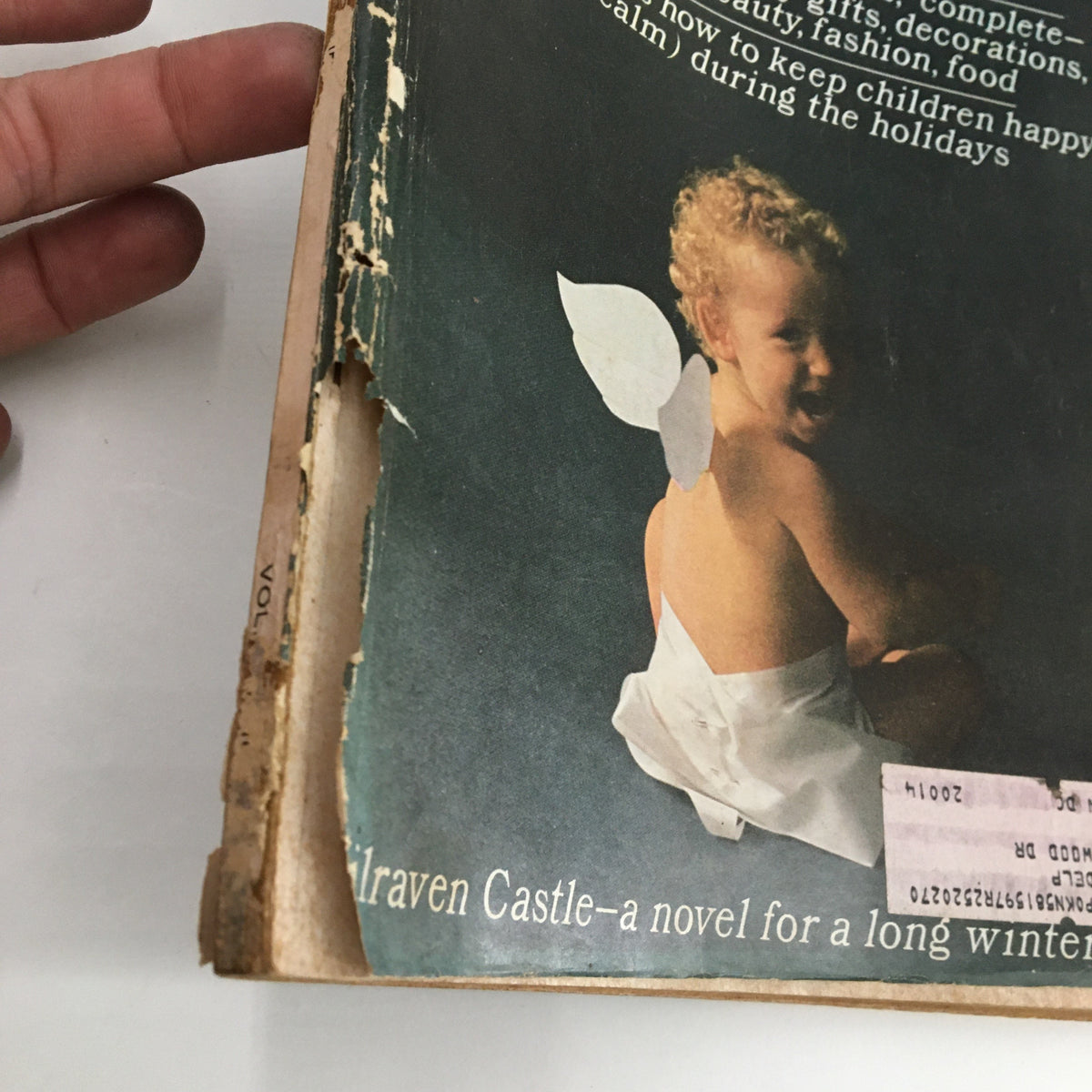Cover of Redbook Magazine December 1965 featuring a child with angel wings, emphasizing the theme of keeping children happy during the holidays.
