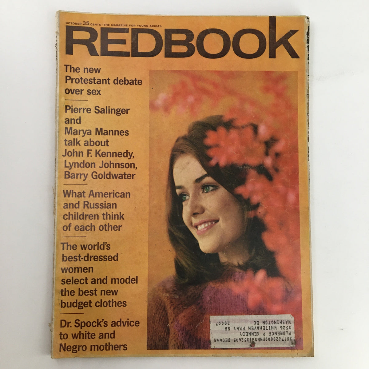 Cover of Redbook Magazine from October 1964 featuring Pierre Salinger and Marya Mannes discussing JFK, alongside a youthful model with brown hair and green eyes, adorned with autumn leaves in the background.