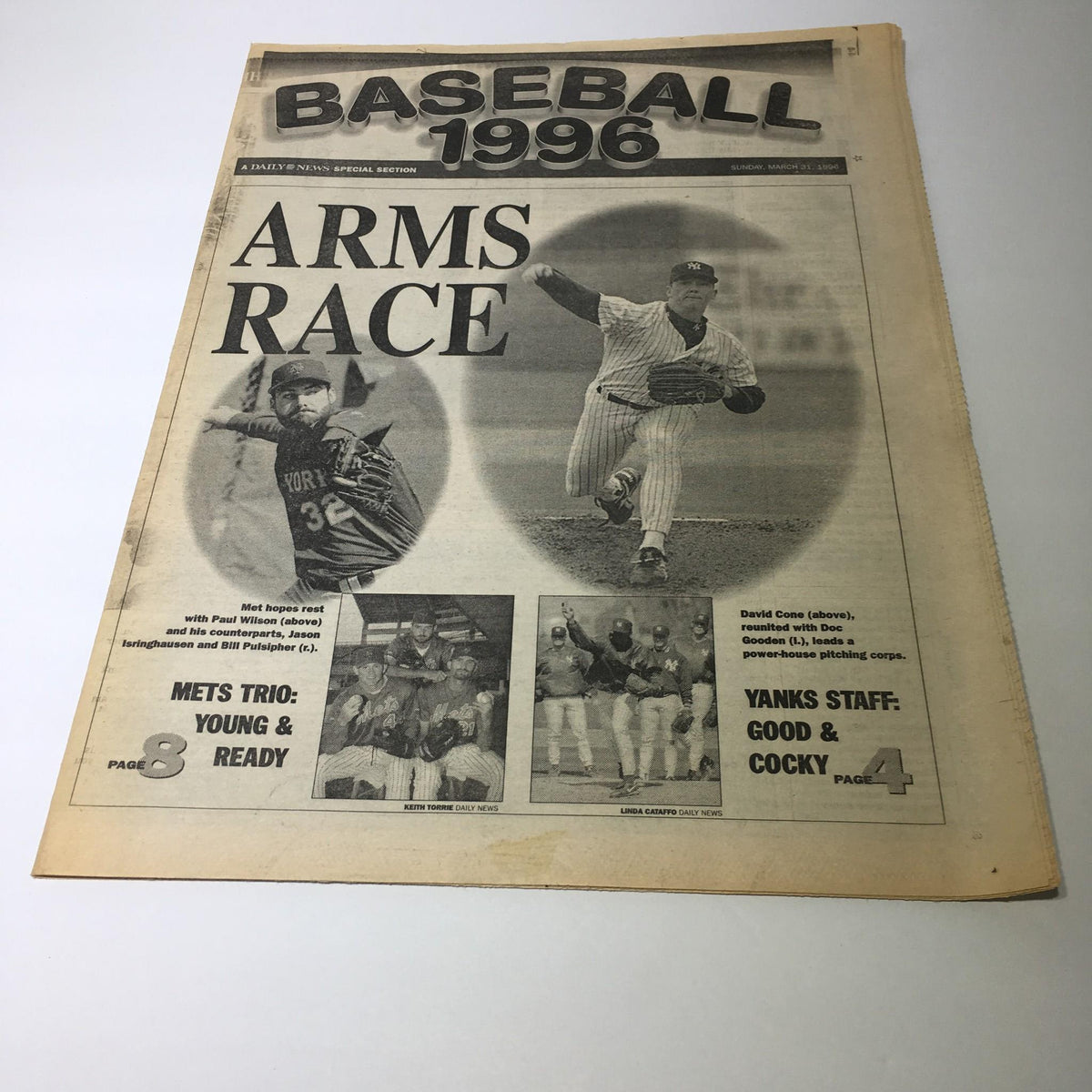 NY Daily News front page from March 31, 1996, featuring the headline 'Baseball 1996 Arms Race'. The image shows a collage with photos of baseball players, including New York Mets and Yankees players, highlighting the competitive nature of the 1996 baseball season.