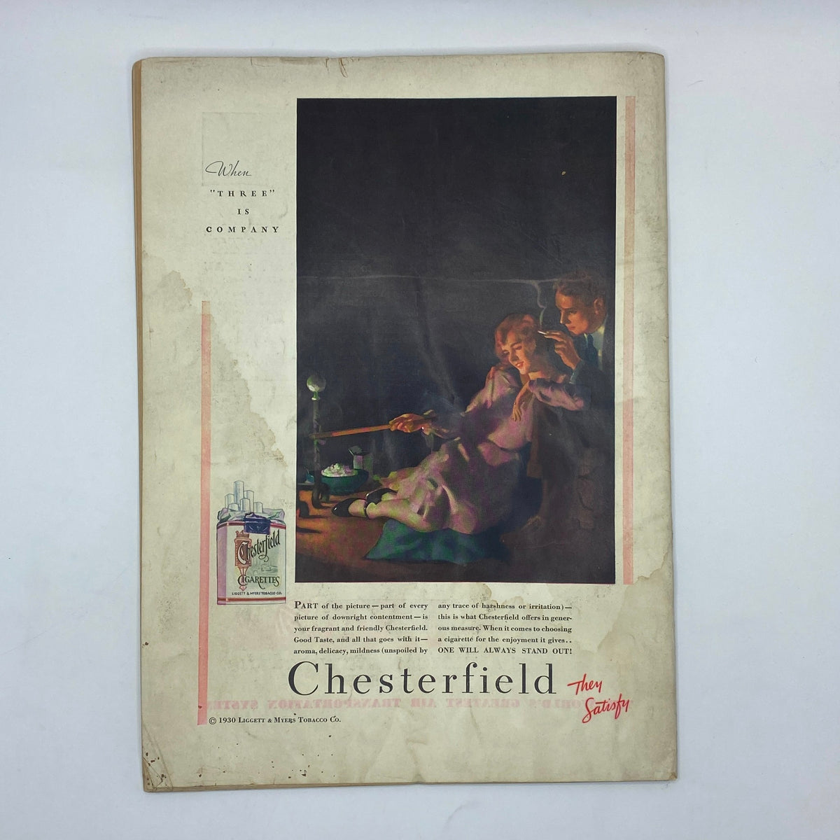 An advertisement from The New Yorker magazine January 3, 1931, promoting Chesterfield cigarettes with an artistic portrayal of a couple enjoying a moment together.