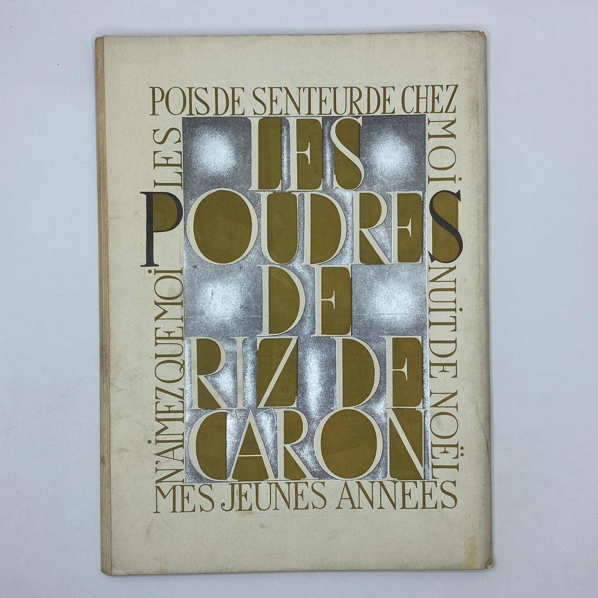 Decorative cover of a vintage perfume booklet titled 'Les Poudres de Riz de Caron' featured in The New Yorker Complete Magazine December 5, 1931.