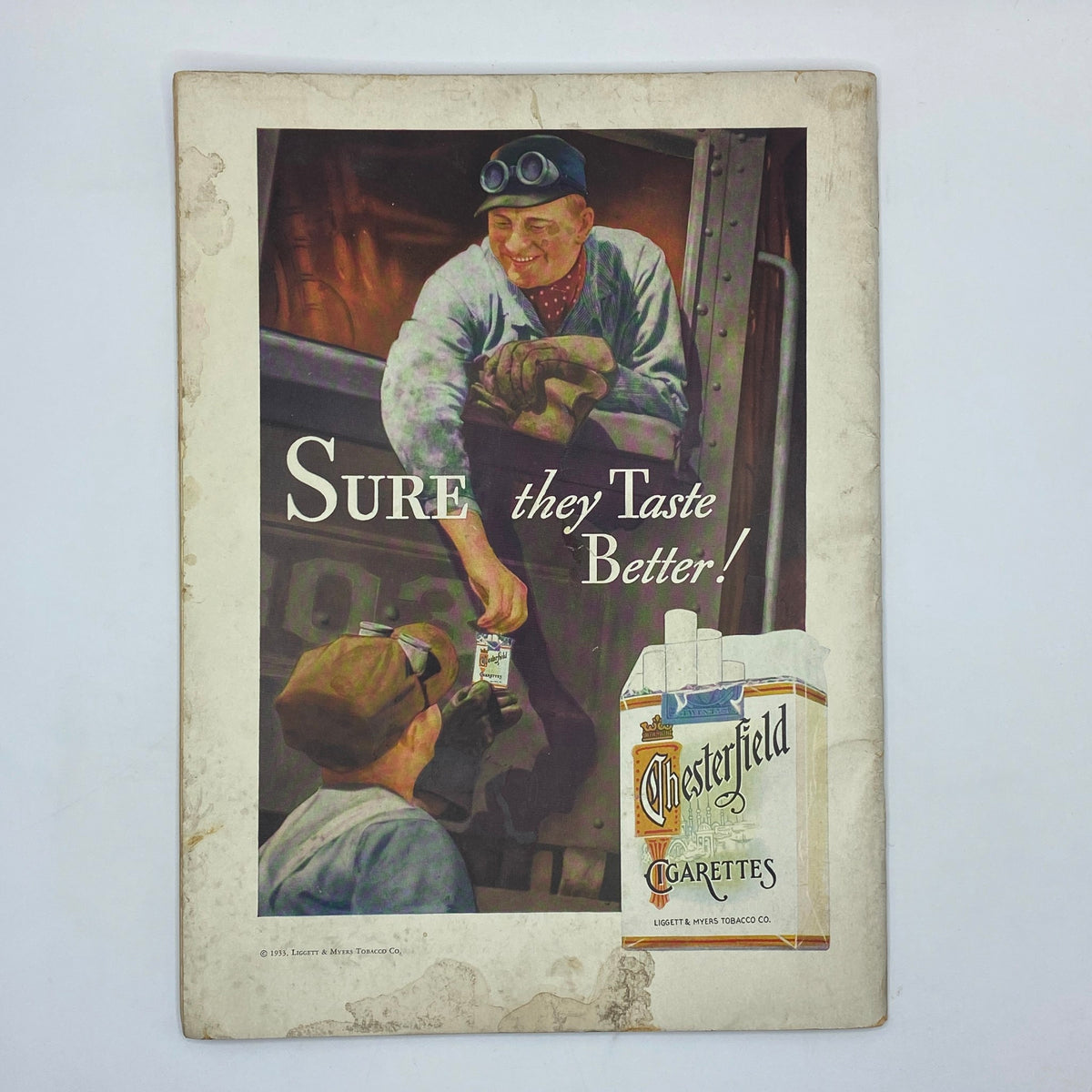 Vintage advertisement featuring two men enjoying Chesterfield cigarettes, with the text 'SURE they Taste Better!', from The New Yorker Complete Magazine May 6, 1933 Richard Decker Cover.