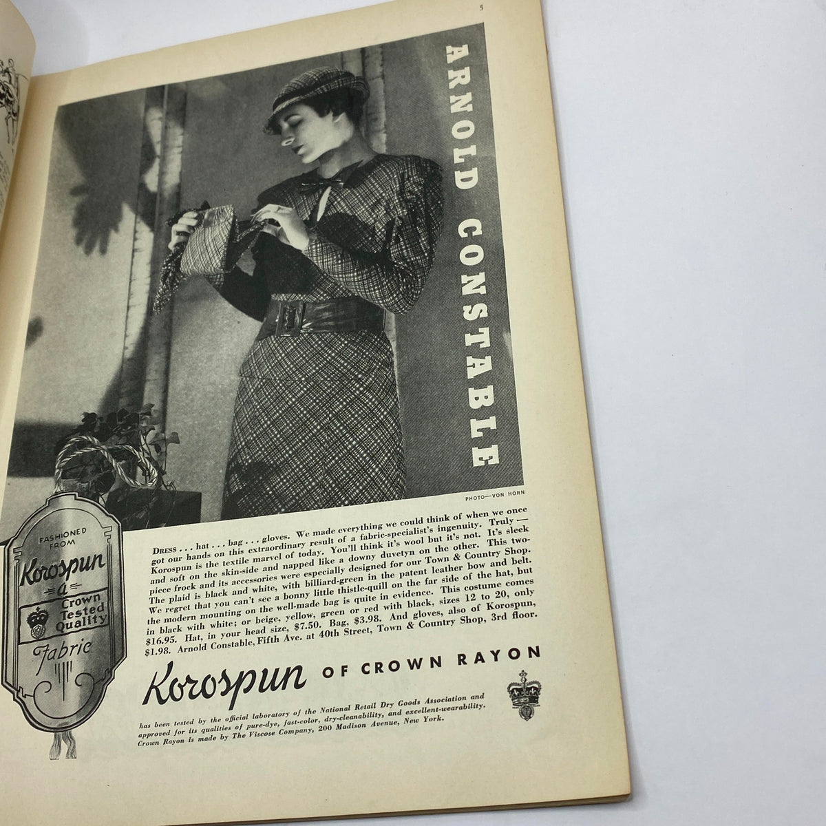 Advertisement page from The New Yorker Complete Magazine September 16, 1933, showcasing Arnold Constable's fashion with a model wearing a stylish outfit.