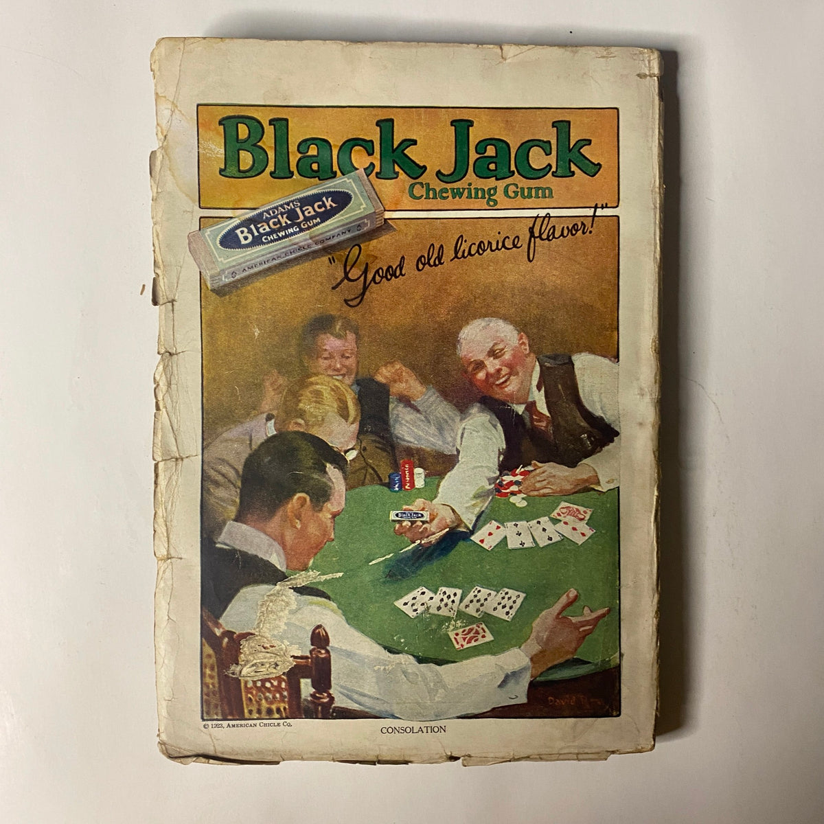 Vintage advertisement for Black Jack Chewing Gum featured in a magazine, emphasizing 'Good old licorice flavor', alongside three men playing cards.