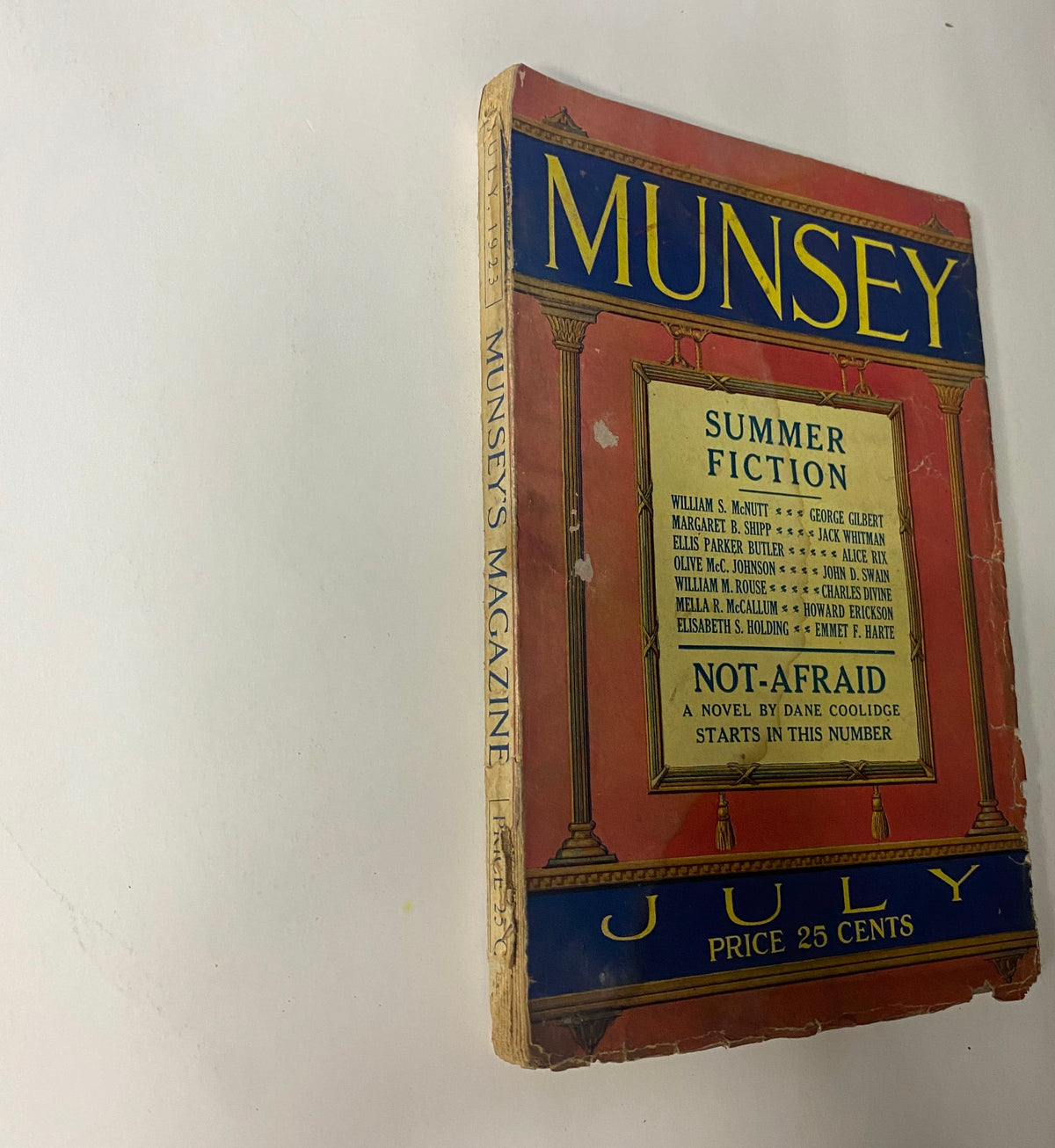 Side view of Munsey's Magazine July 1923 displaying the title 'Not-Afraid' by Dane Coolidge. The magazine's cover showcases summer fiction and notable authors.