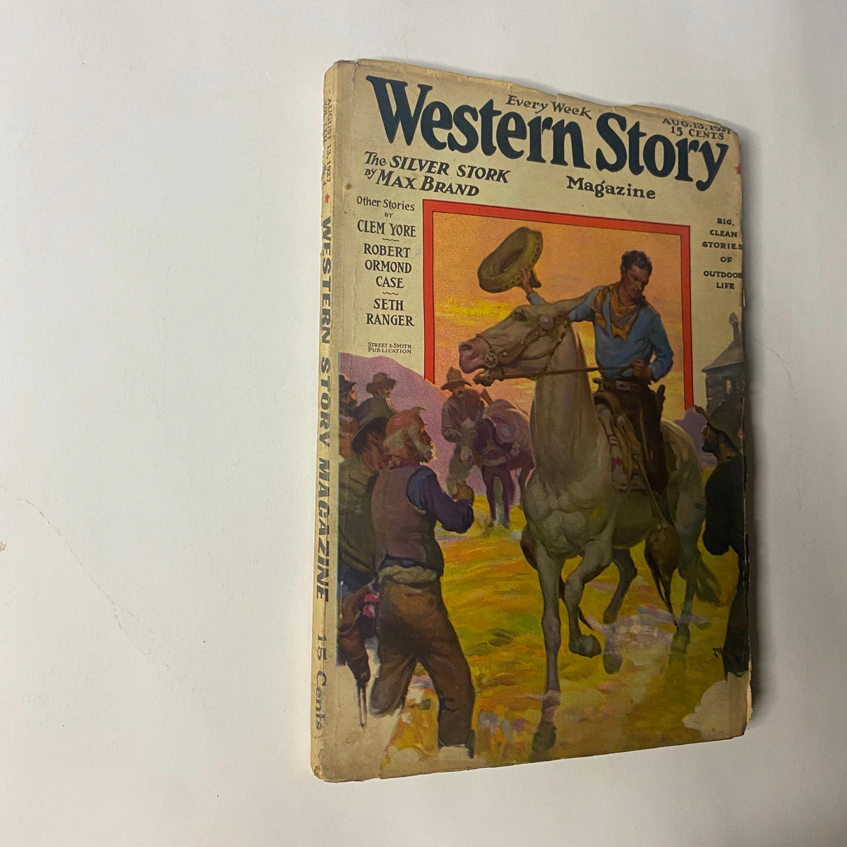 Cover of Western Story Magazine, August 13, 1927, featuring 'The Silver Stork' by Max Brand, showcasing a scene of cowboys and horses.