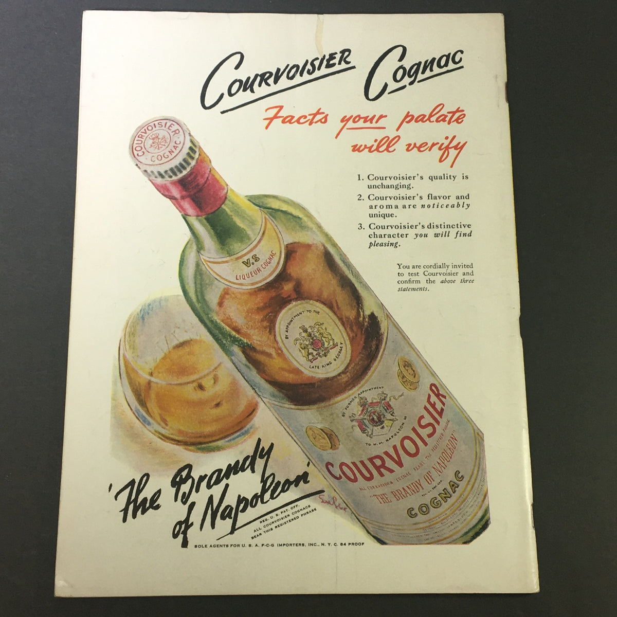 Vintage advertisement featuring Courvoisier Cognac, labeled as 'The Brandy of Napoleon', with a bottle illustration and tasting notes, from the January 1946 edition of VTG Gourmet: The Magazine of Good Living.