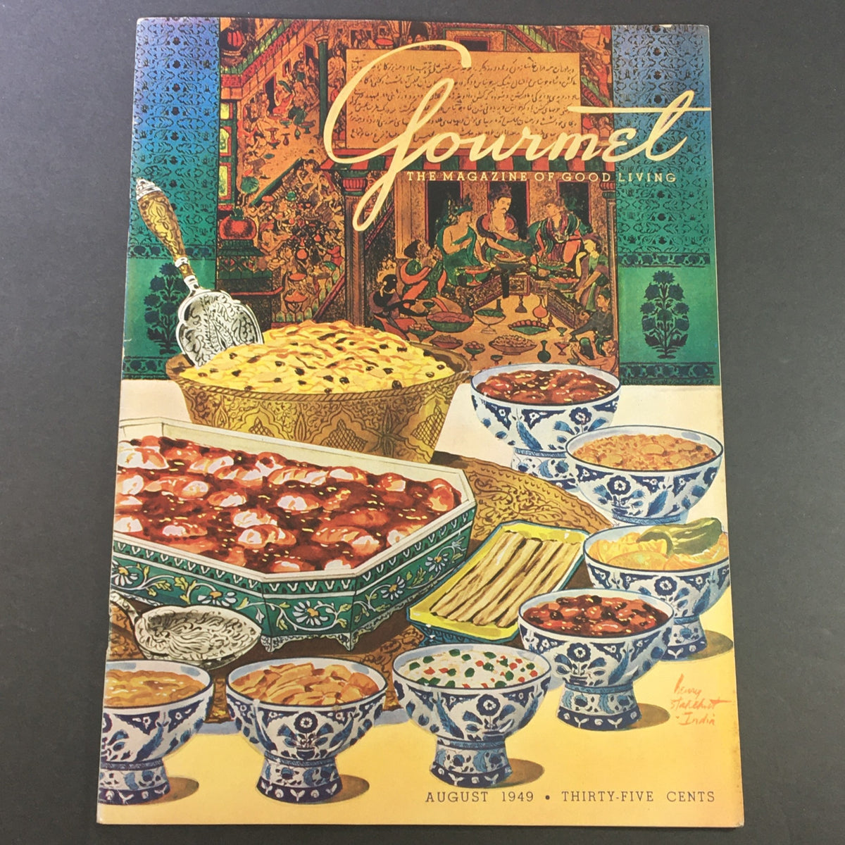 Cover of VTG Gourmet The Magazine of Good Living August 1949, featuring an elegant table setting with various gourmet dishes and intricate designs.
