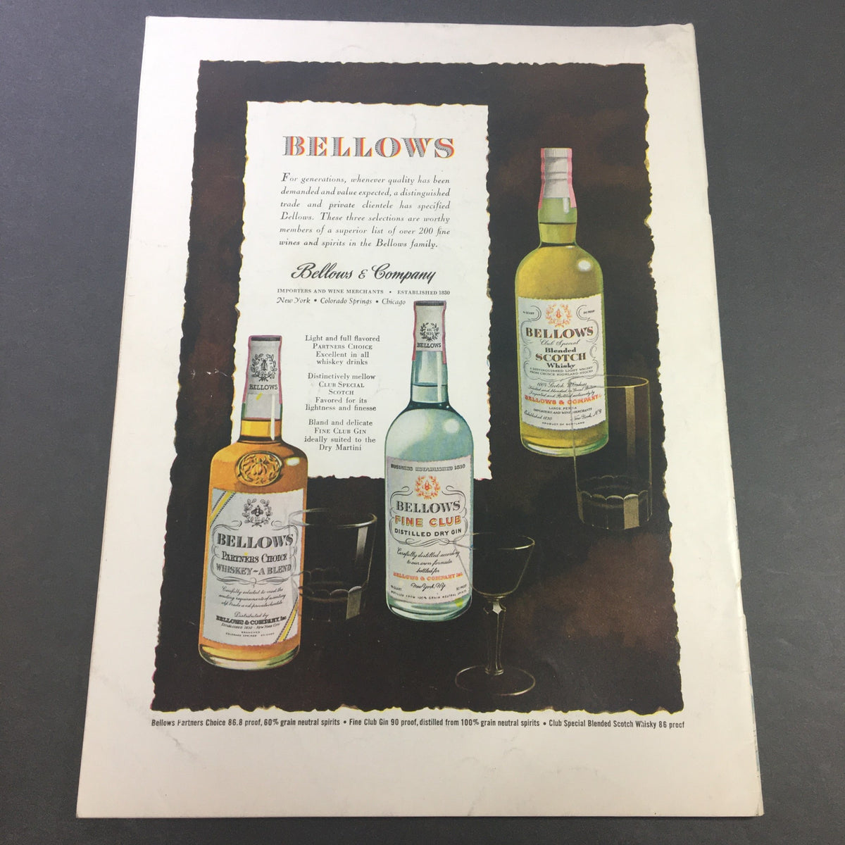 Advertisement page from VTG Gourmet The Magazine of Good Living July 1949 showcasing Bellows spirits and beverages with elegant design.