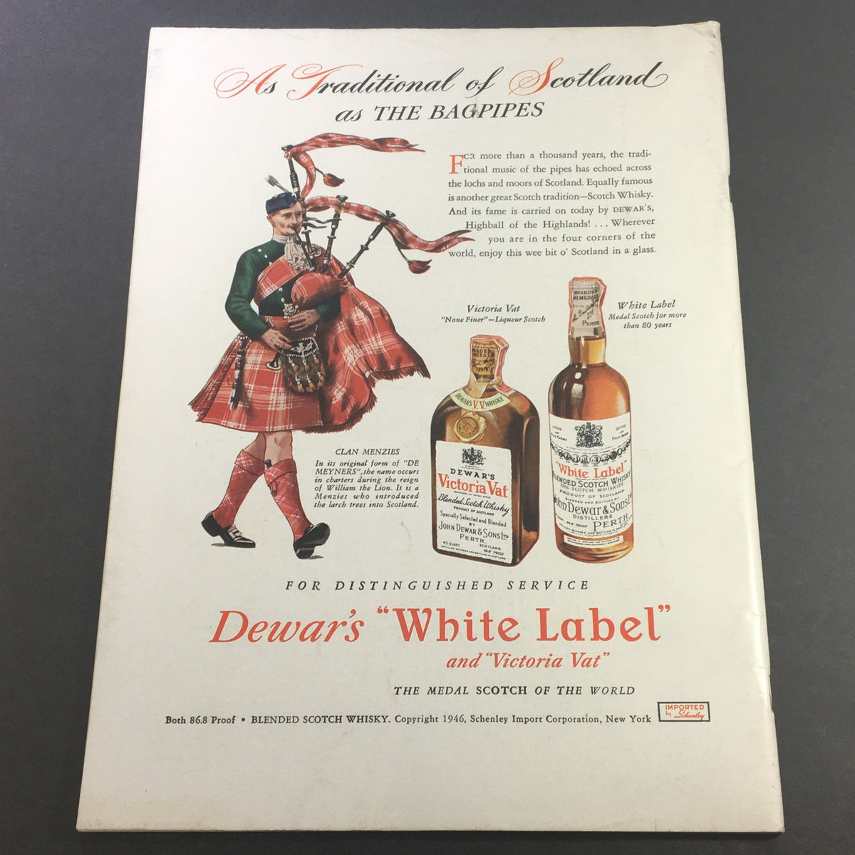 Vintage advertisement from April 1946 featuring Dewar's White Label Scotch and Victoria Vat with a bagpiper in traditional Scottish attire. This image complements the VTG Gourmet The Magazine of Good Living April 1946, highlighting culinary culture and beverage pairings.