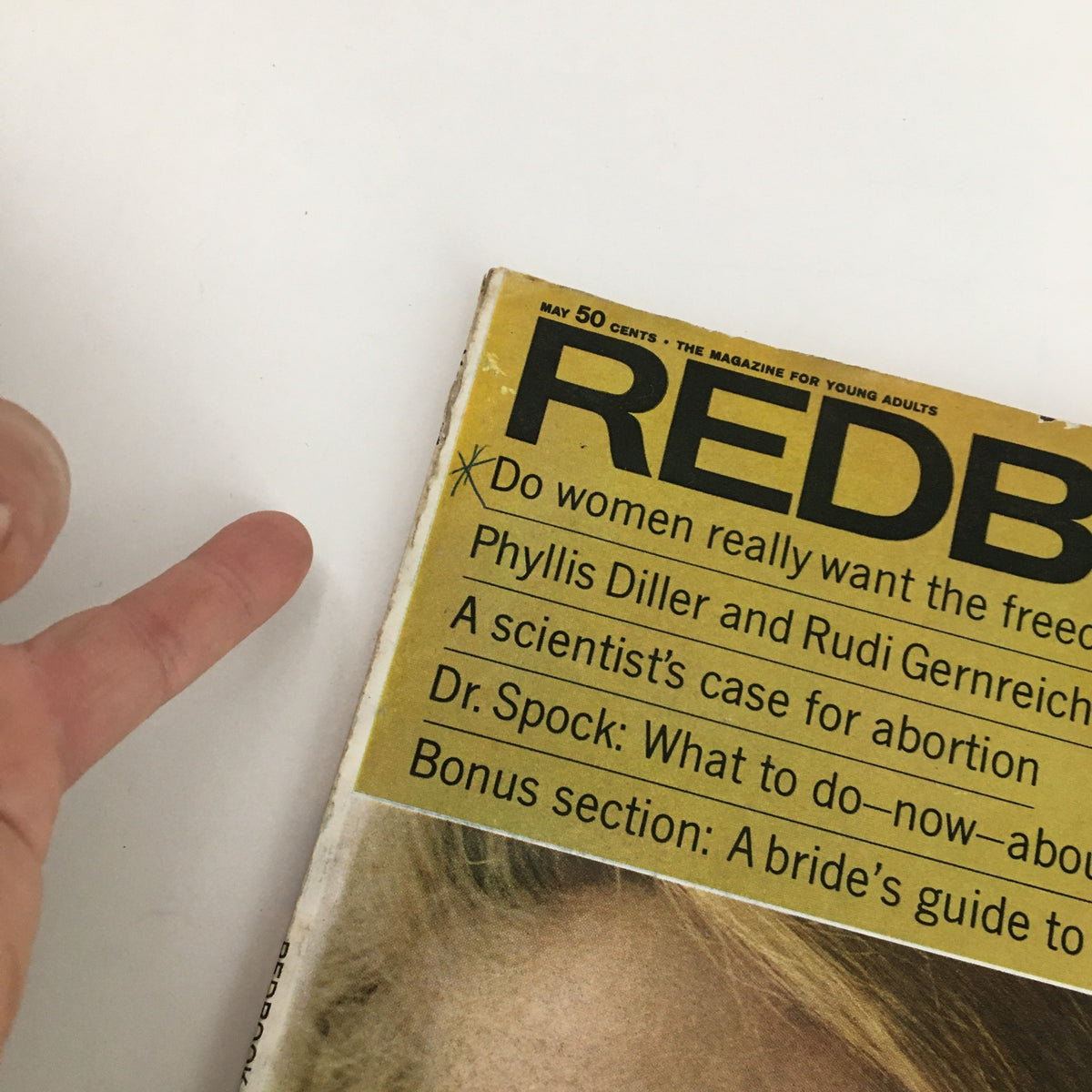 Side view of Redbook Magazine May 1967 Vol. 129 #1, highlighting key articles including Phyllis Diller and Rudi Gernreich, with a focus on societal issues and trends from the 1960s.