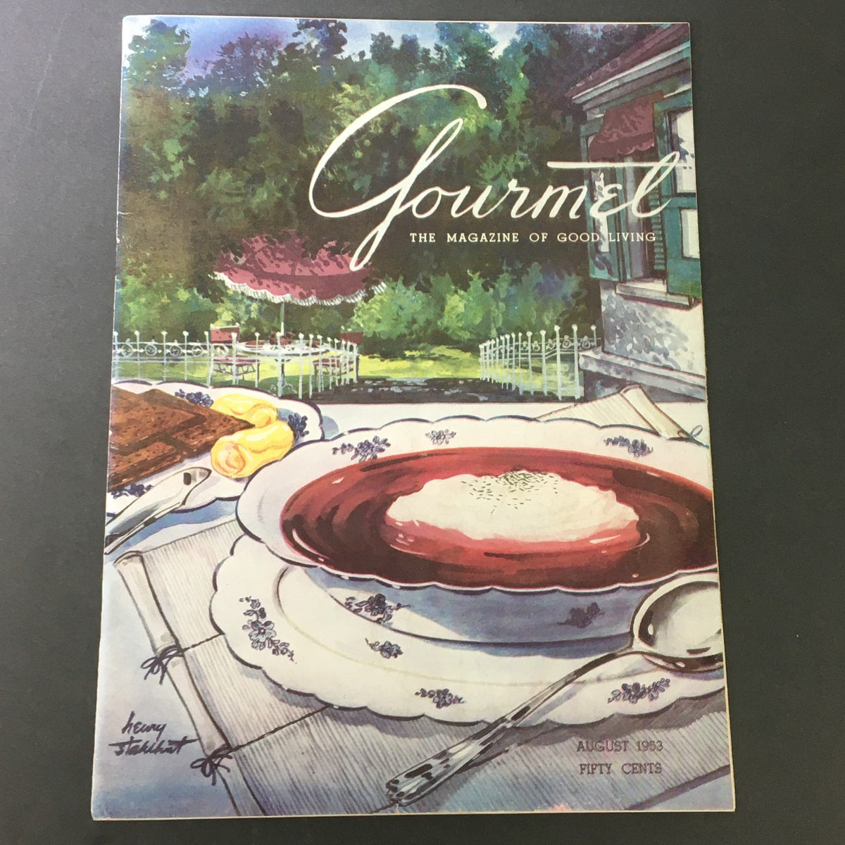 Cover of VTG Gourmet The Magazine of Good Living August 1953 featuring a beautifully illustrated setting with fine dining elements including dessert and cutlery, reflecting the culinary arts of the 1950s.