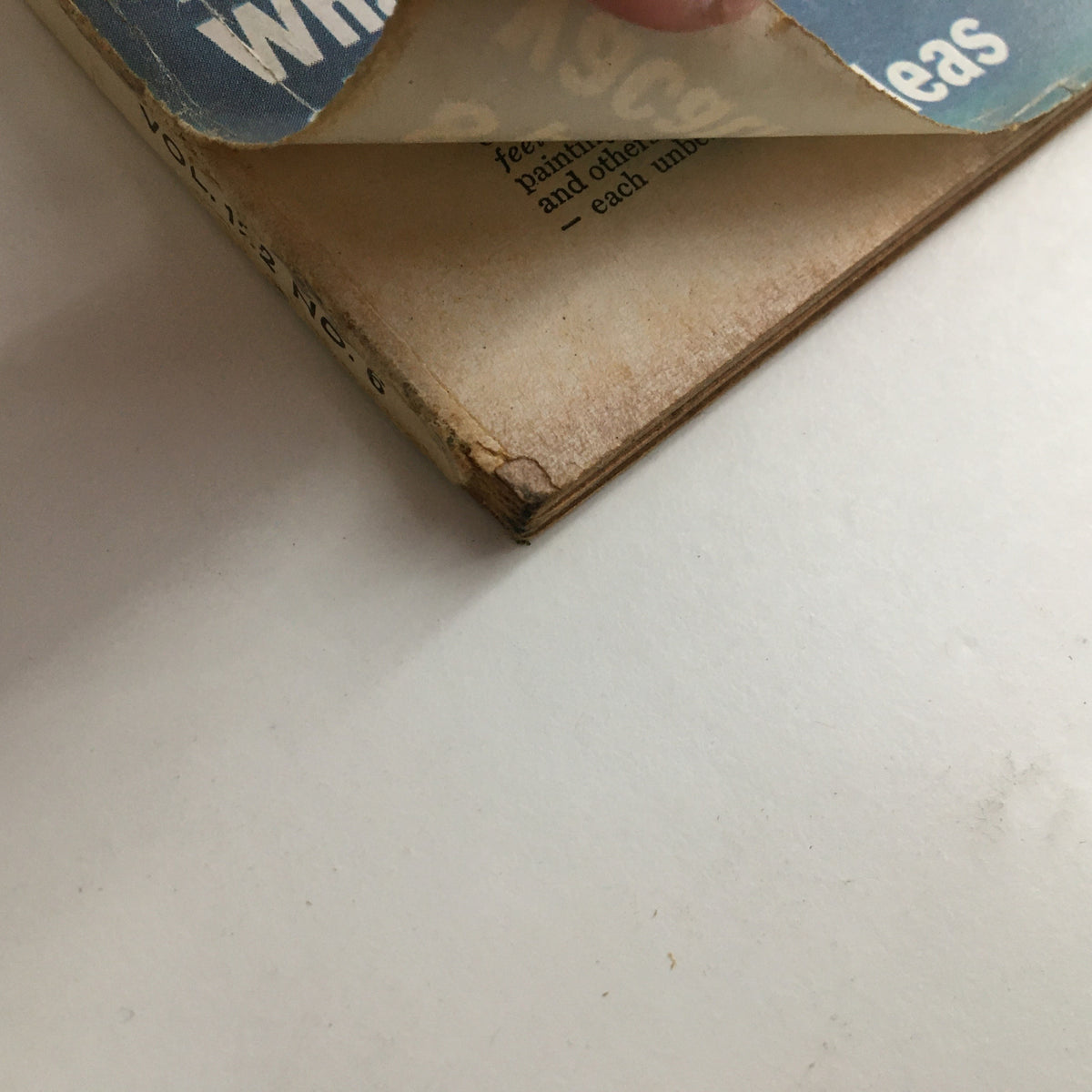 Detail of the spine of the Redbook Magazine April 1964, showing wear and age, emphasizing its collectible nature and historical significance.