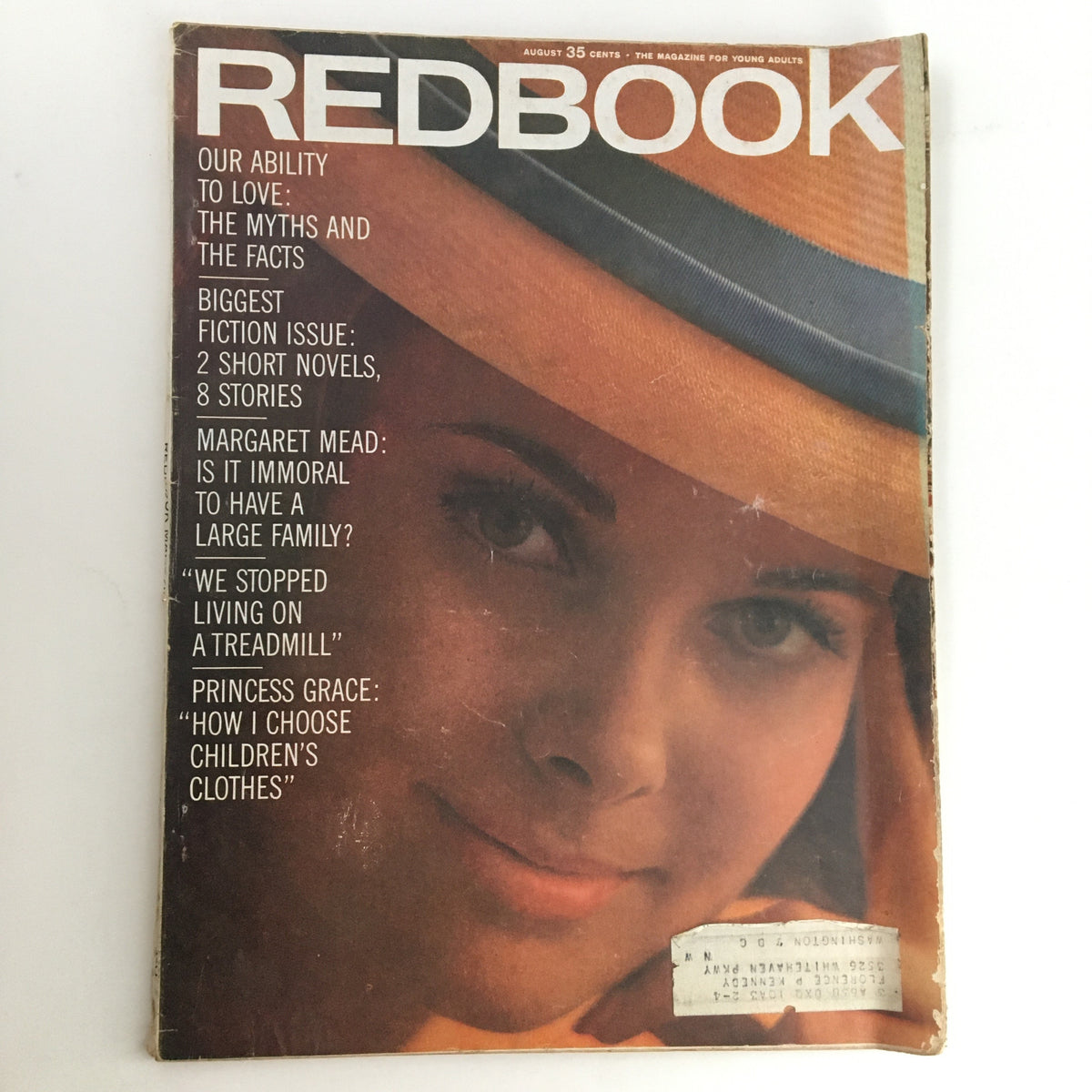 Redbook Magazine August 1963 cover featuring the title and an image of a young woman wearing a hat, highlighting Margaret Mead's article 'Is It Immoral To Have A Large Family?' The cover showcases themes of love and family.