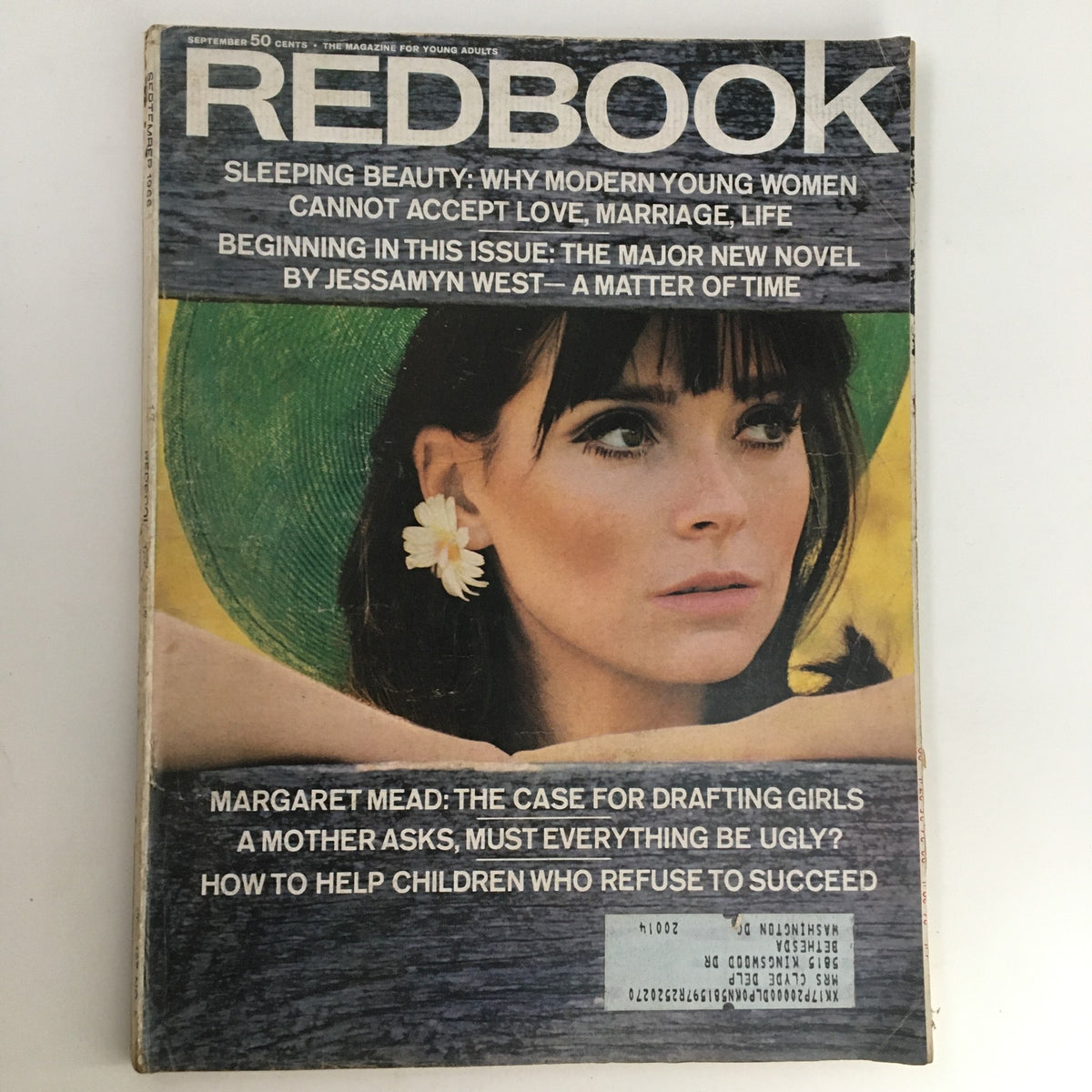 Cover of Redbook Magazine September 1966 featuring an eye-catching article by Margaret Mead titled 'The Case for Drafting Girls'. The cover showcases a woman with a flower in her hair, reflecting 1960s fashion and cultural themes.