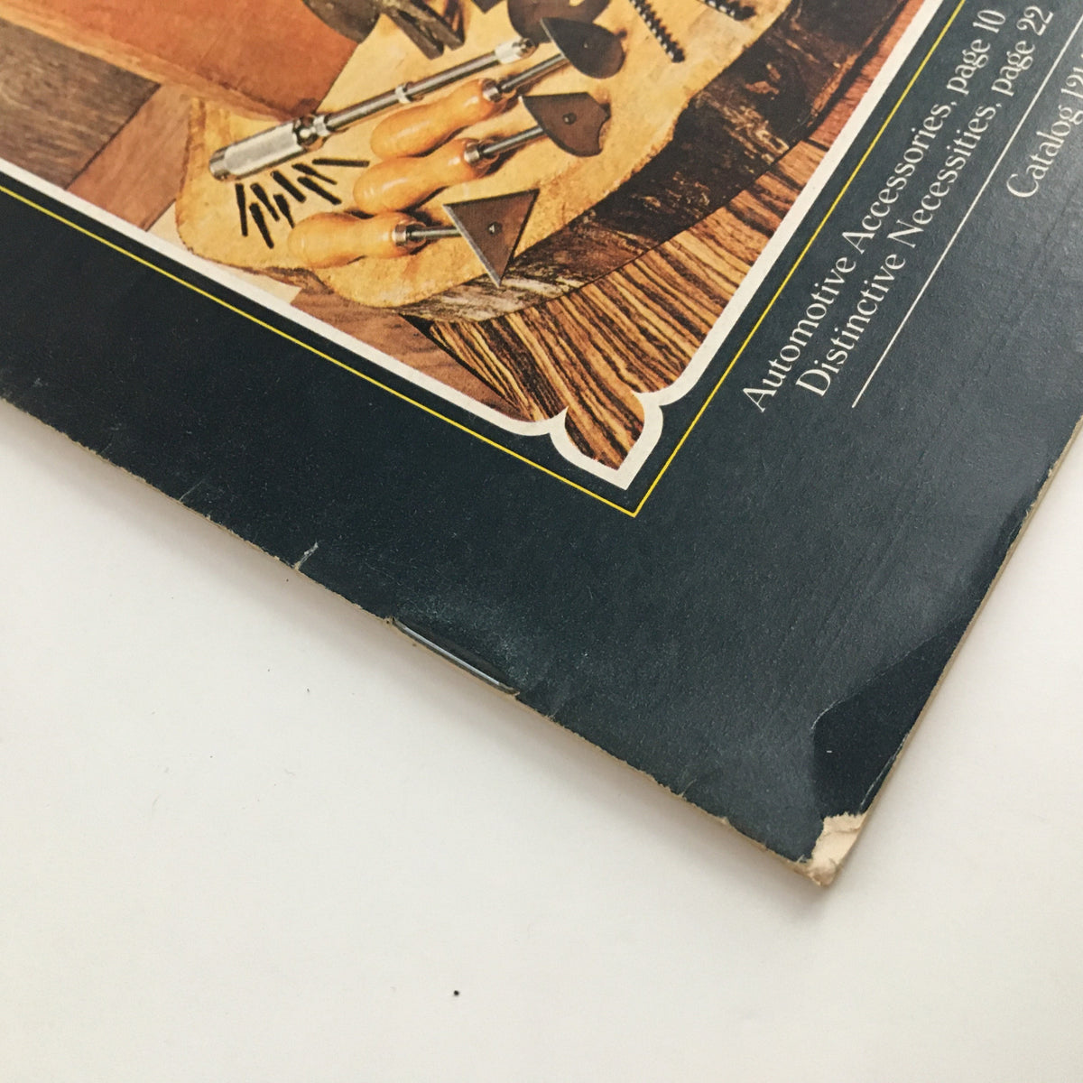 Close-up view of the edge of the 1975 Brookstone Company Hard-To-Find Tools Fall Catalog, highlighting minor wear and the vintage charm of the catalog.