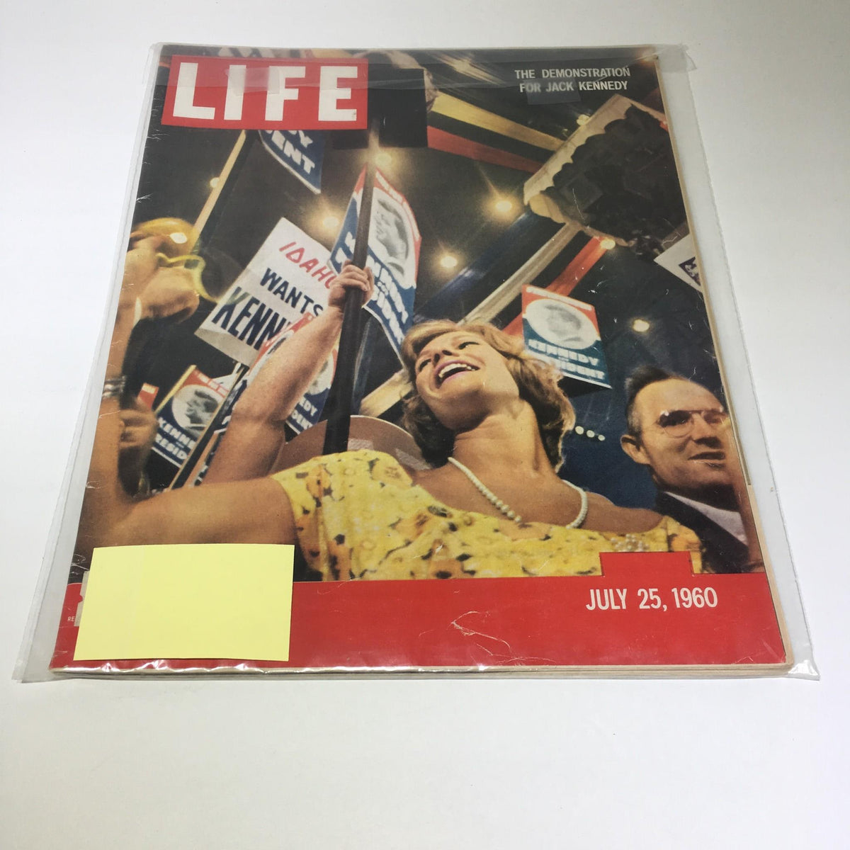 Life Magazine cover dated July 25, 1960, featuring a demonstration for Jack Kennedy, showcasing a joyful woman holding a sign, along with other supporters in the background.