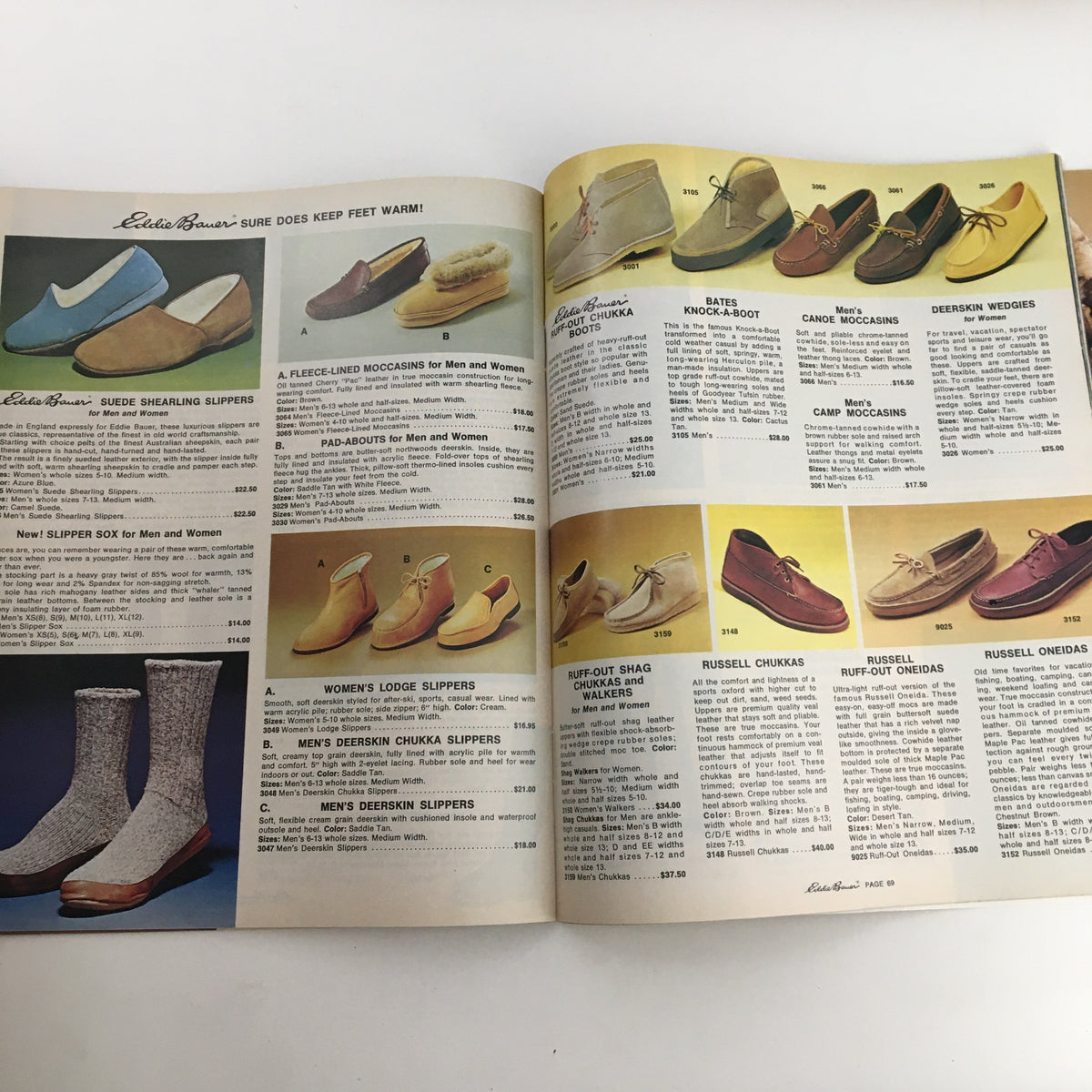1976 Eddie Bauer Christmas Goose Down Garments Catalog featuring a selection of warm footwear including slippers, moccasins, and boots.