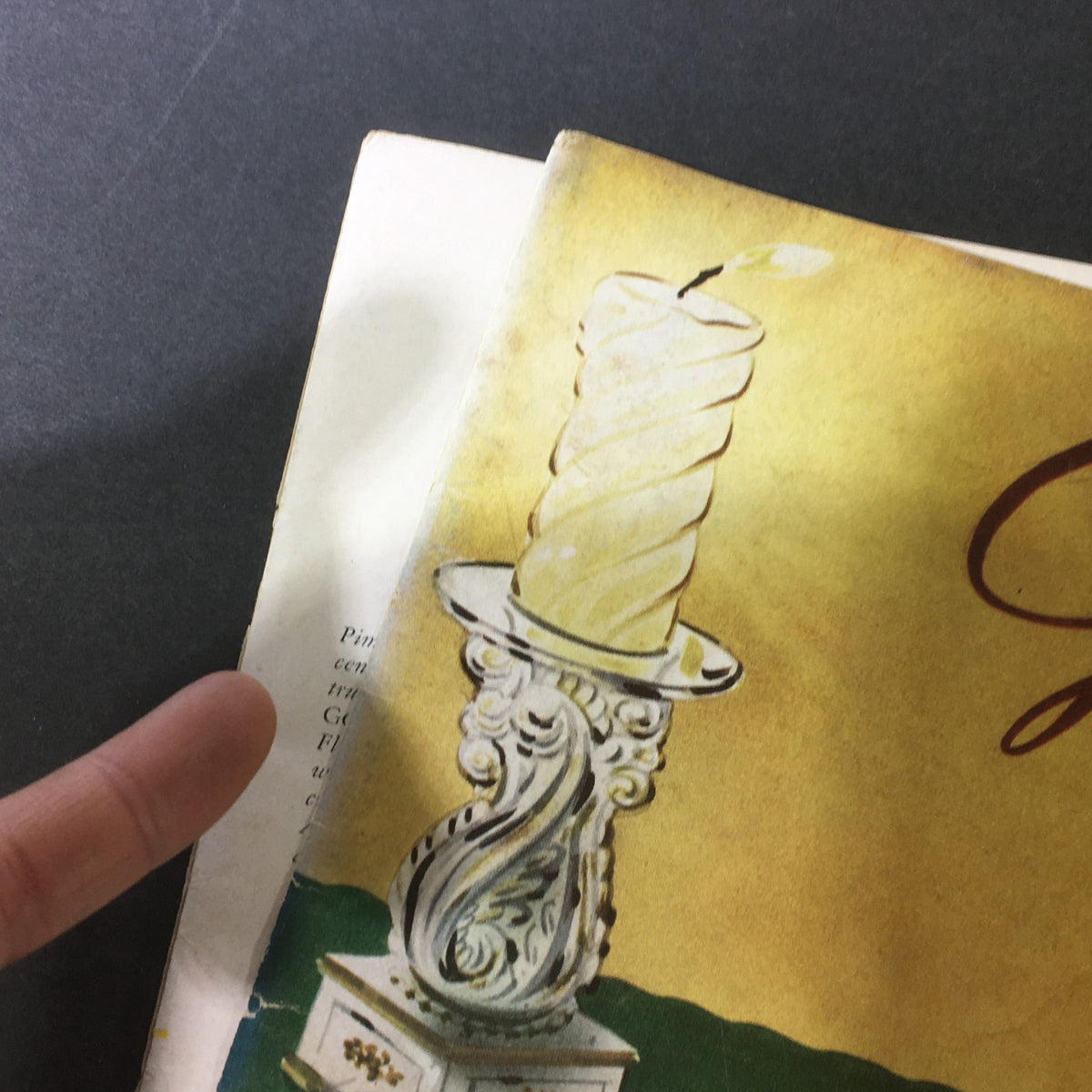 Close-up detail of the cover of VTG Gourmet The Magazine of Good Living July 1954, highlighting an elegant candle design and vibrant colors.