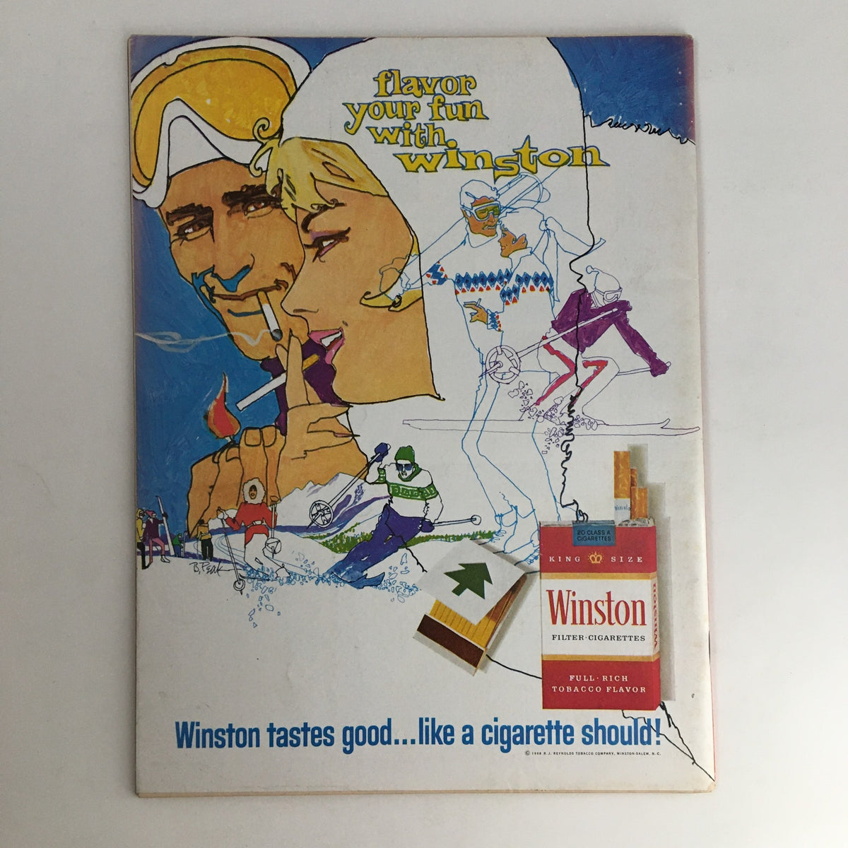 Vintage Winston cigarette advertisement showcasing a colorful illustration of skiing and leisure activities, promoting the slogan 'Winston tastes good...like a cigarette should!'.
