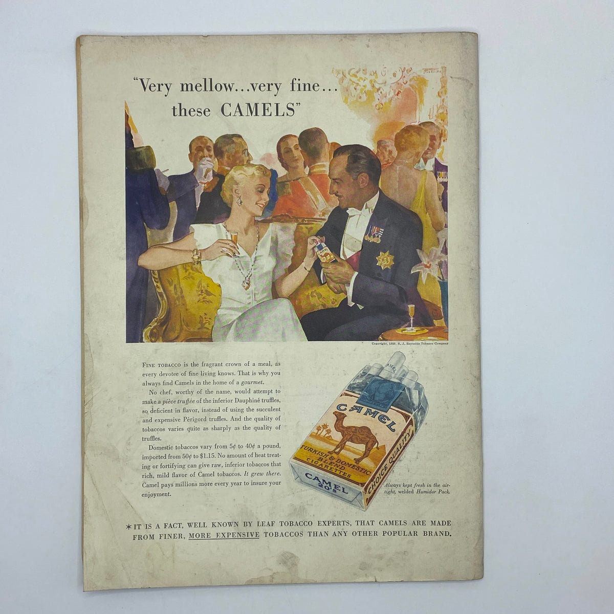 Vintage advertisement featuring a glamorous couple and a Camel cigarettes pack, with the title 'The New Yorker Complete Magazine April 22, 1933 Helen E. Hokinson Cover.' The scene reflects the high-society lifestyle of the early 20th century.