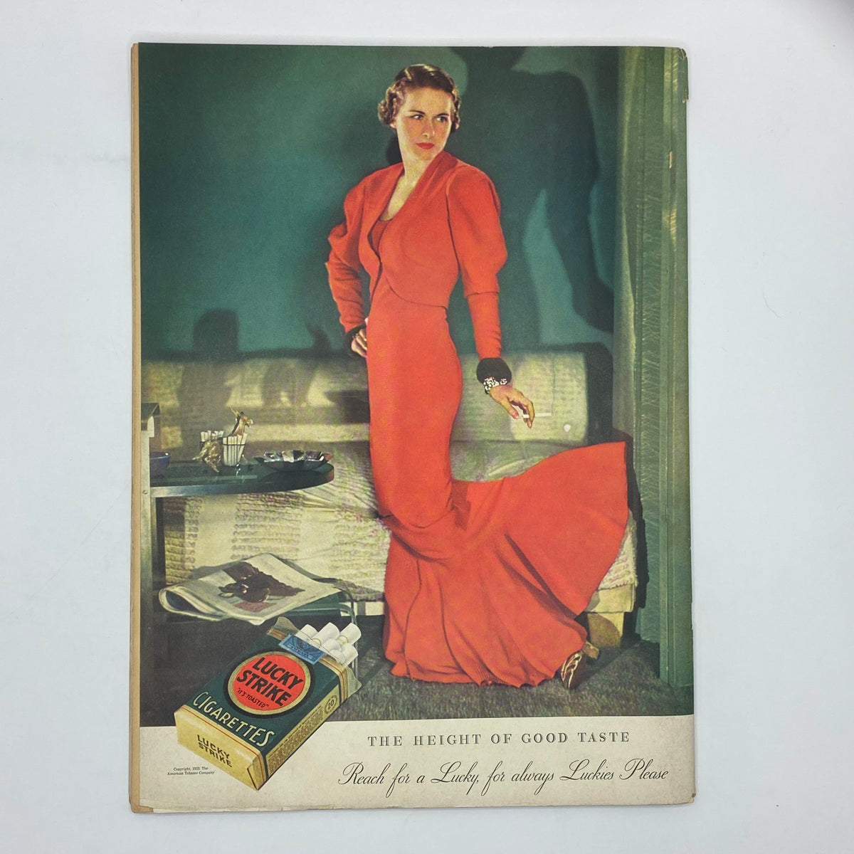 Cover of The New Yorker magazine dated January 6, 1934, illustrating a stylish woman in a red gown, promoting Lucky Strike cigarettes, reflecting fashion trends of the 1930s.