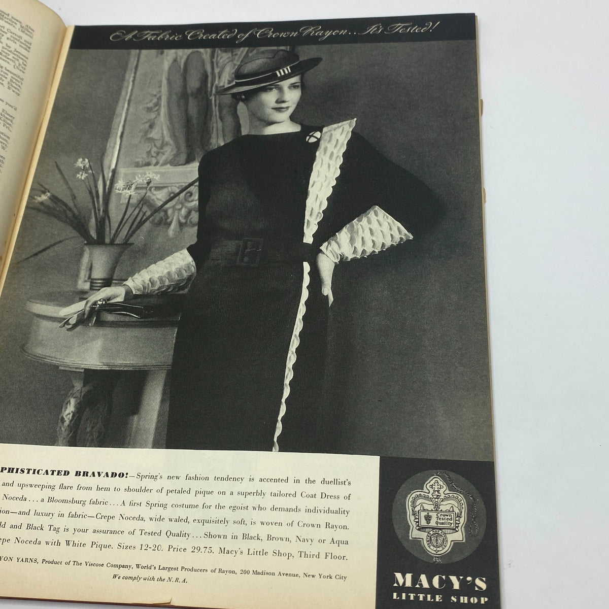 Vintage advertisement featuring a model in a sophisticated dress by Macy's, showcasing a fashion trend from the 1930s. The ad is related to The New Yorker Complete Magazine February 10, 1934.