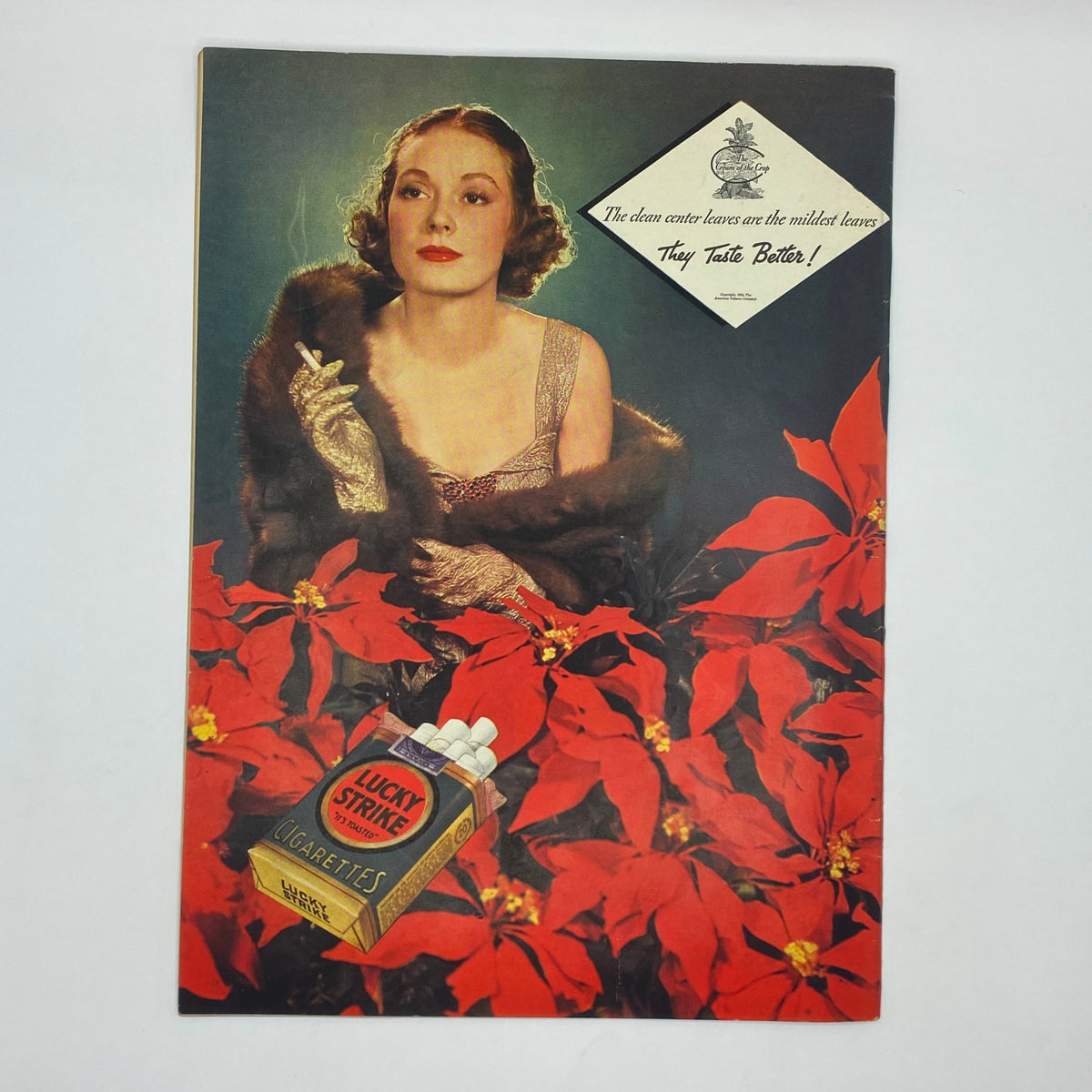 Vintage advertisement featuring a glamorous woman with a cigarette next to a Lucky Strike cigarettes pack, surrounded by red poinsettias, from The New Yorker magazine, December 22, 1934.