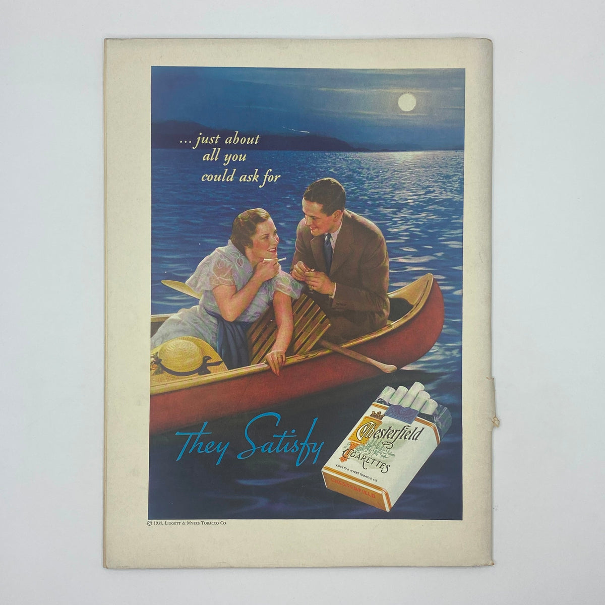 Back cover of The New Yorker magazine from September 21, 1935, displaying a colorful advertisement for Masterfield cigarettes, featuring a romantic scene on the water.