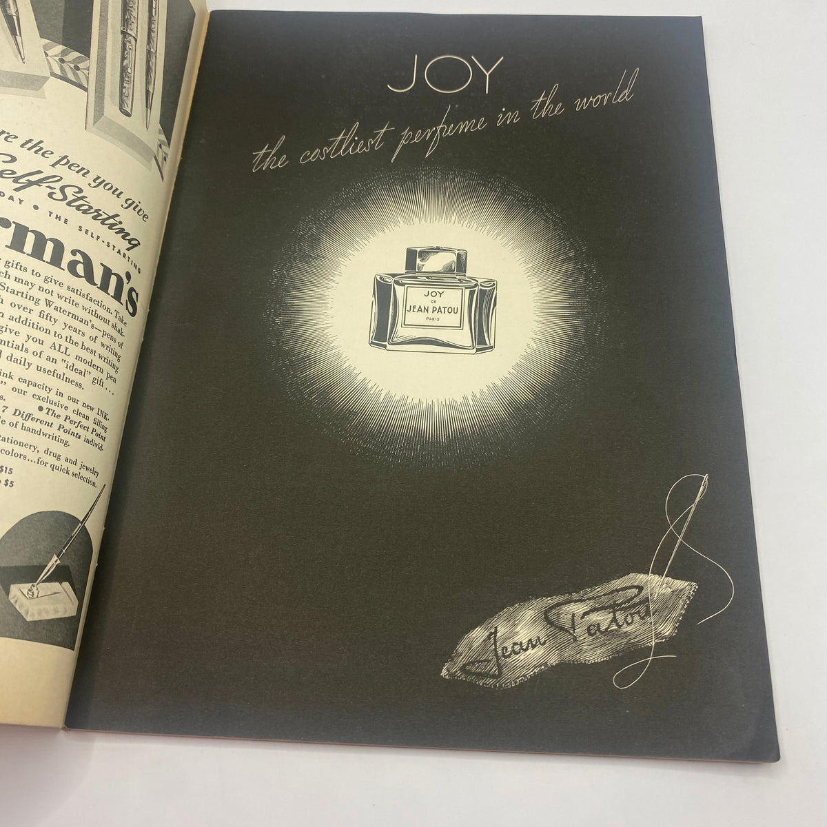 Advertisement page from The New Yorker magazine dated December 14, 1935, promoting Jean Patou's 'Joy' perfume, illustrated with elegant designs reflective of 1930s fashion.