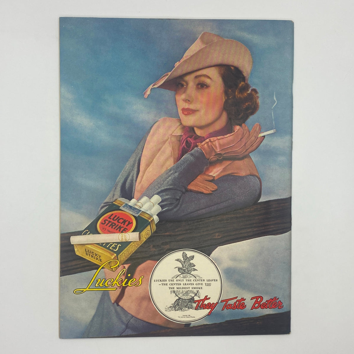 Vintage advertisement from The New Yorker Complete Magazine April 27, 1935 promoting Lucky Strike cigarettes with an elegant woman in a hat, captioned 'Lucky Strike They Taste Better'.