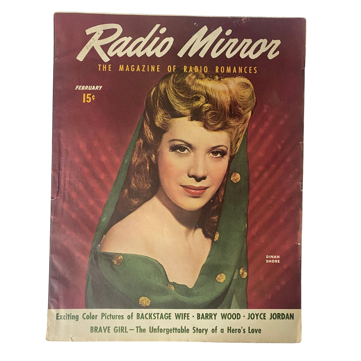 Cover of Radio Mirror Magazine February 1944 featuring Dinah Shore, showcasing a vintage portrait with vibrant colors set against a green backdrop. The magazine highlights radio romances and entertainment stories.