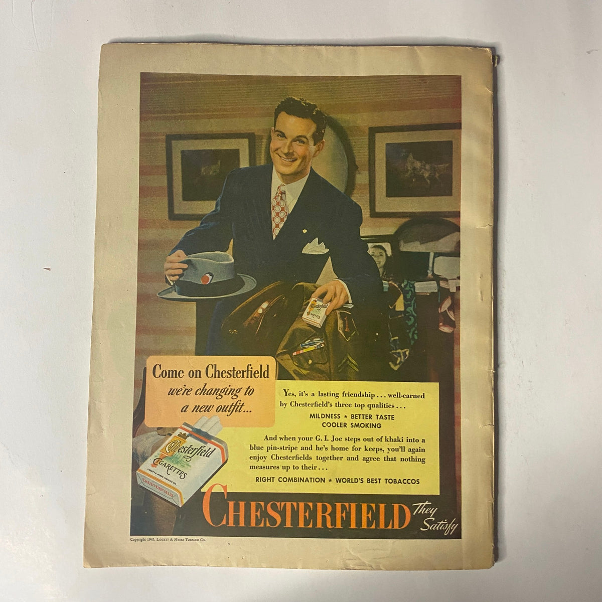 Advertisement page from Radio Romances Magazine March 1945 for Chesterfield cigarettes, featuring a well-dressed man holding a hat and standing next to a vintage motorcycle.