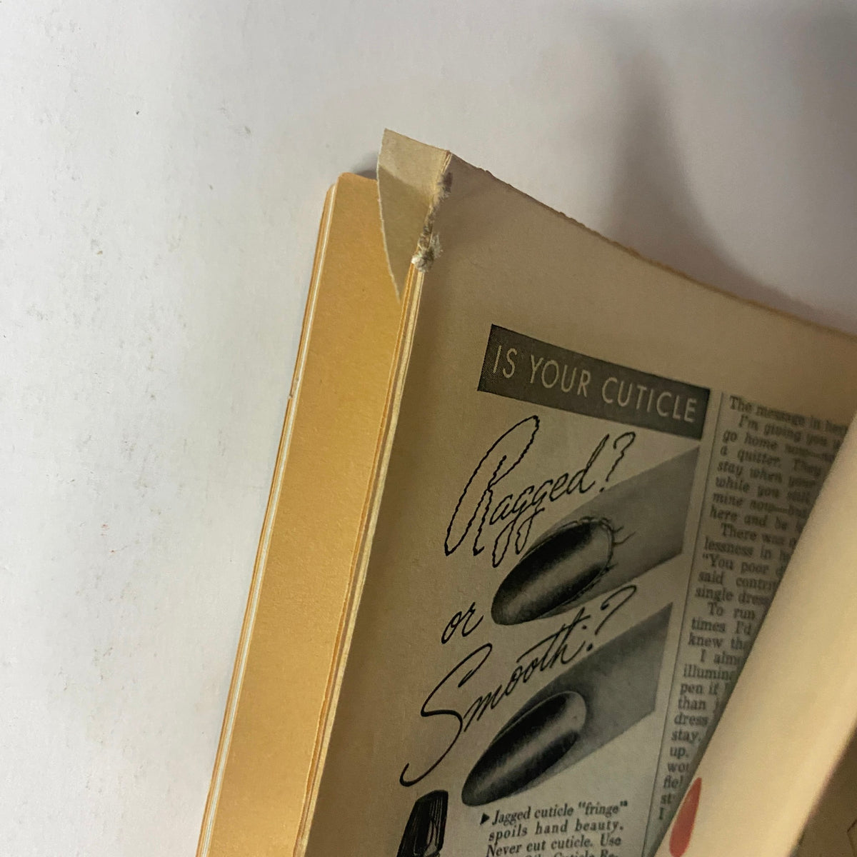 Close-up image of the spine of the Radio Romances Magazine September 1944 featuring Marjorie Stoneridge on the cover, illustrating a slight tear at the corner, highlighting its vintage condition.