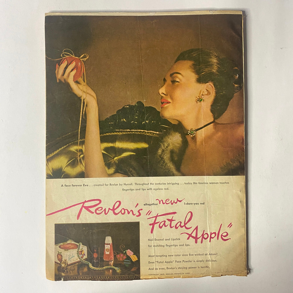 Cover of Radio Romances Magazine November 1945, showcasing a glamorous woman holding an apple, highlighting Revlon's 'Fatal Apple' product advertisement.