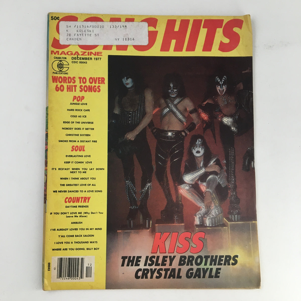 Cover of Song Hits Magazine December 1977 featuring Kiss, The Isley Brothers, and Crystal Gayle. The magazine showcases vibrant colors and bold titles, indicative of the music era.