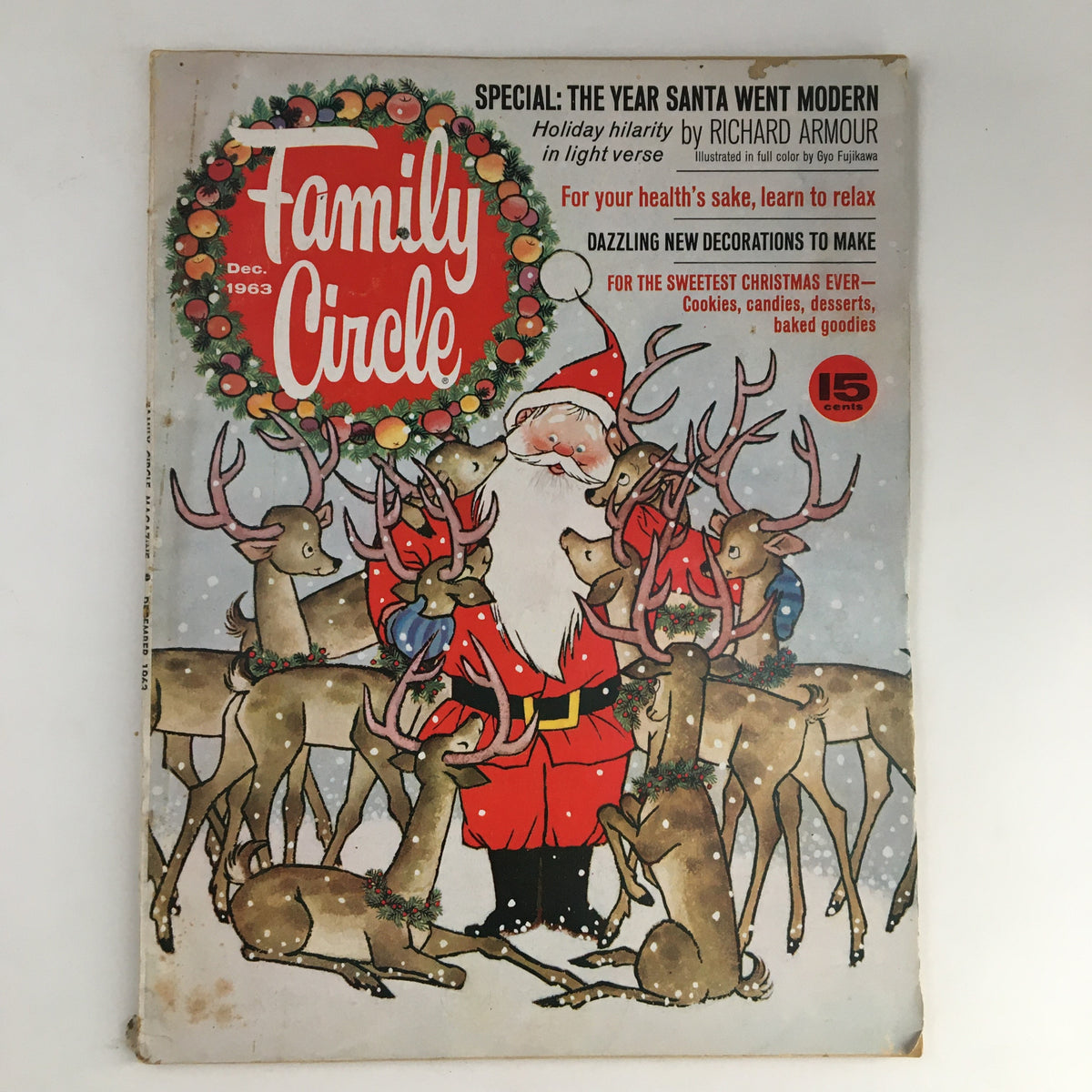Family Circle Magazine December 1963 cover featuring Santa Claus surrounded by reindeer in a snowy setting. The title, 'The Year Santa Went Modern', prominently displayed along with festive decorations.
