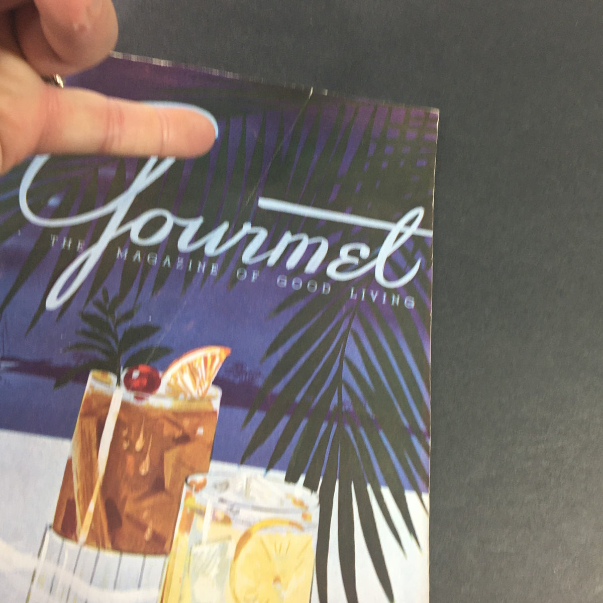 Cover of VTG Gourmet The Magazine of Good Living July 1946 featuring tropical drinks and palm leaves, representing the theme 'Gourmets Aweigh Part II.'