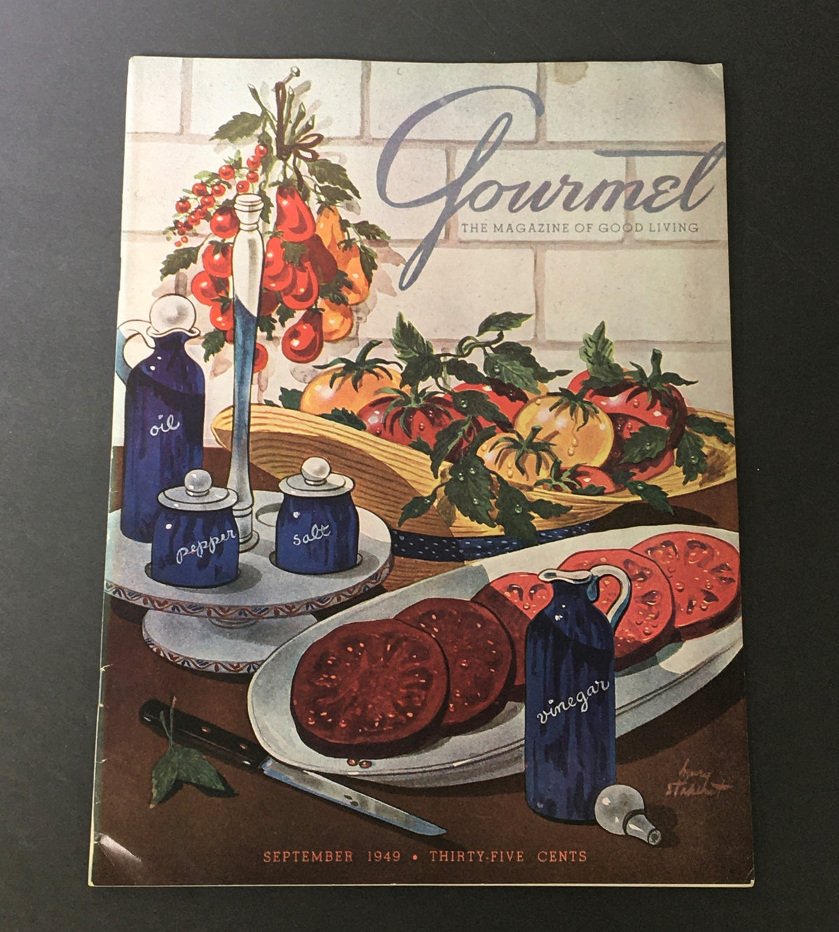 VTG Gourmet The Magazine of Good Living September 1949 cover featuring a classic illustration of tomatoes, oil, salt, and pepper, highlighting culinary themes of the late 1940s.