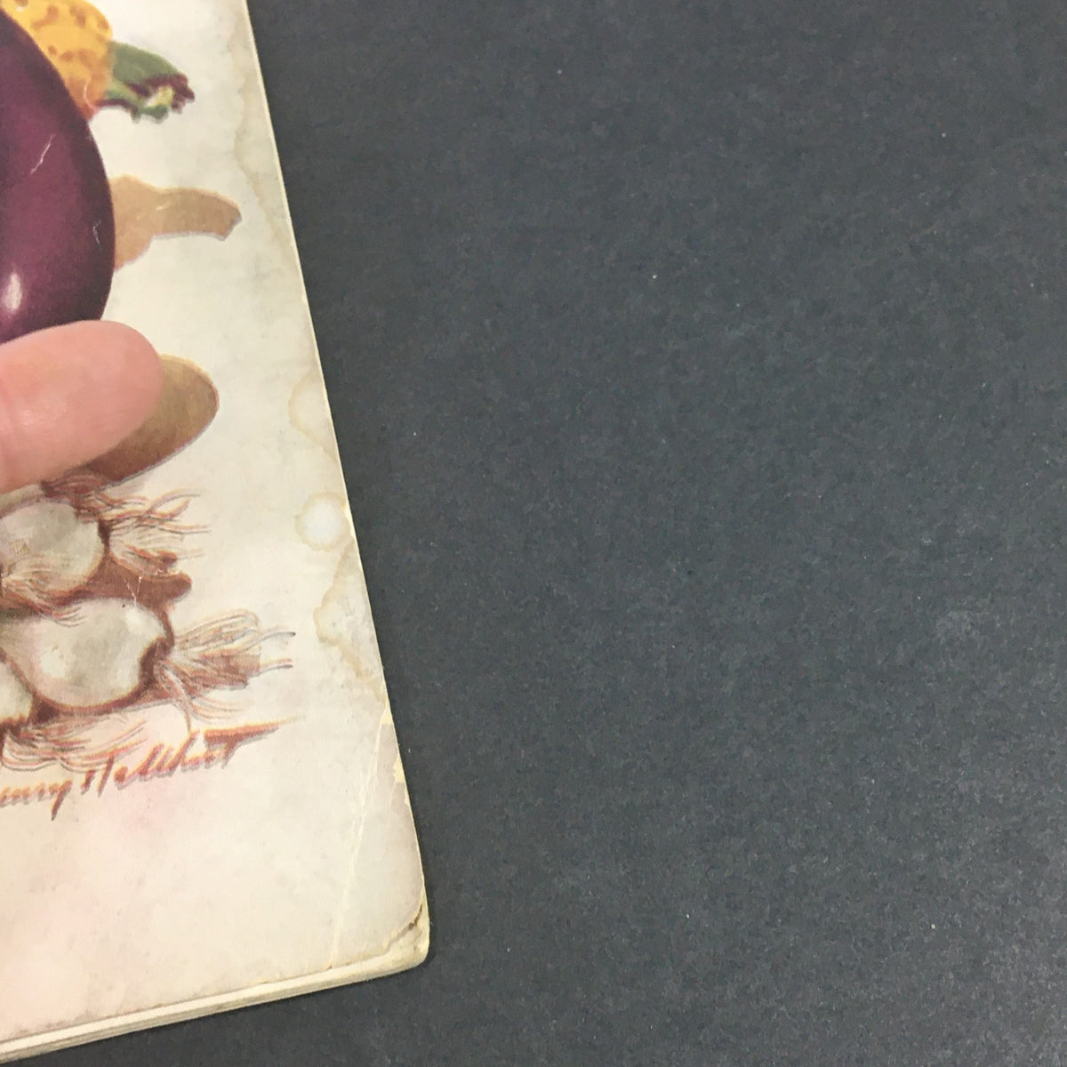 Side view of the September 1944 VTG Gourmet The Magazine of Good Living showcasing rich illustrations and worn pages.