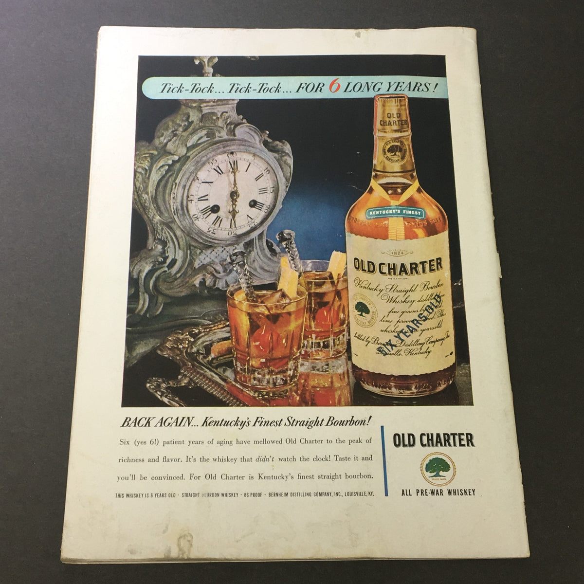 Advertisement for Old Charter Kentucky Straight Bourbon whiskey in the VTG Gourmet The Magazine of Good Living May 1948, highlighting the product's quality and heritage.