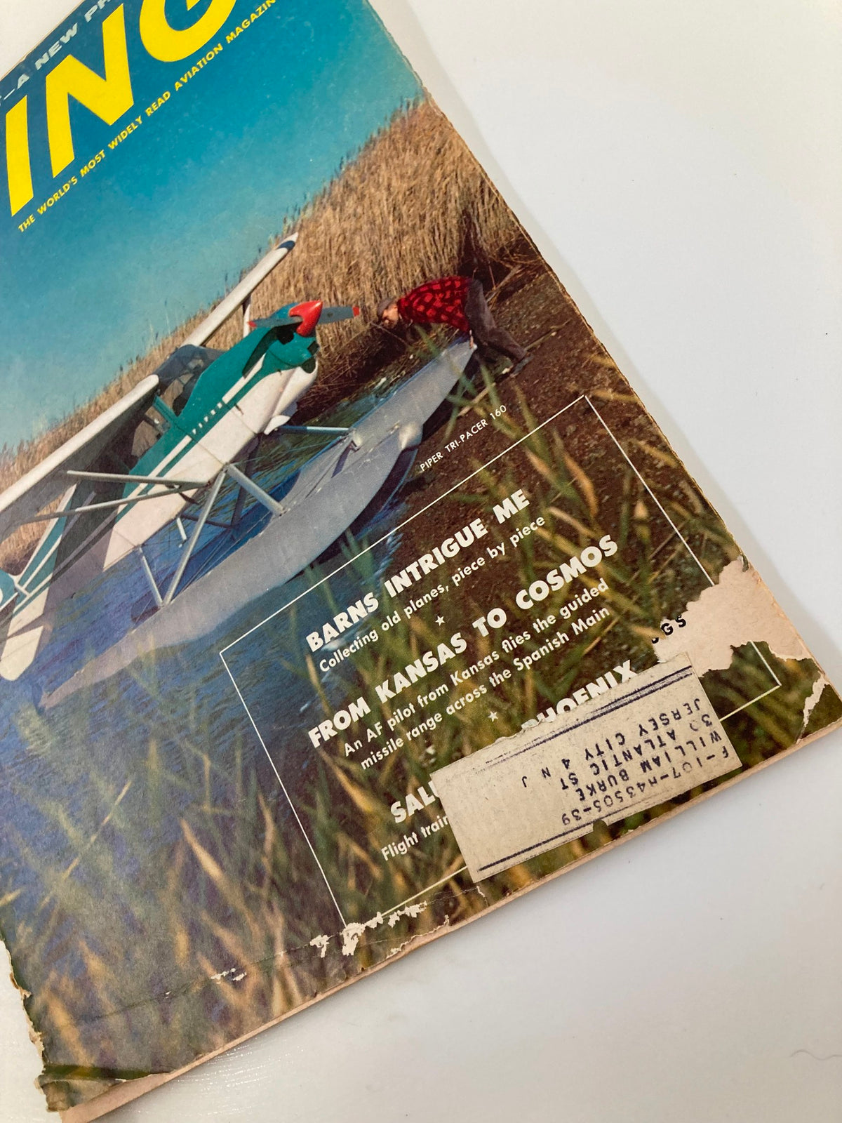 Highlight of the VTG Flying Magazine March 1958 cover, focusing on the Piper Tri-Pacer 160 with a person inspecting the aircraft, emphasizing its historical significance.