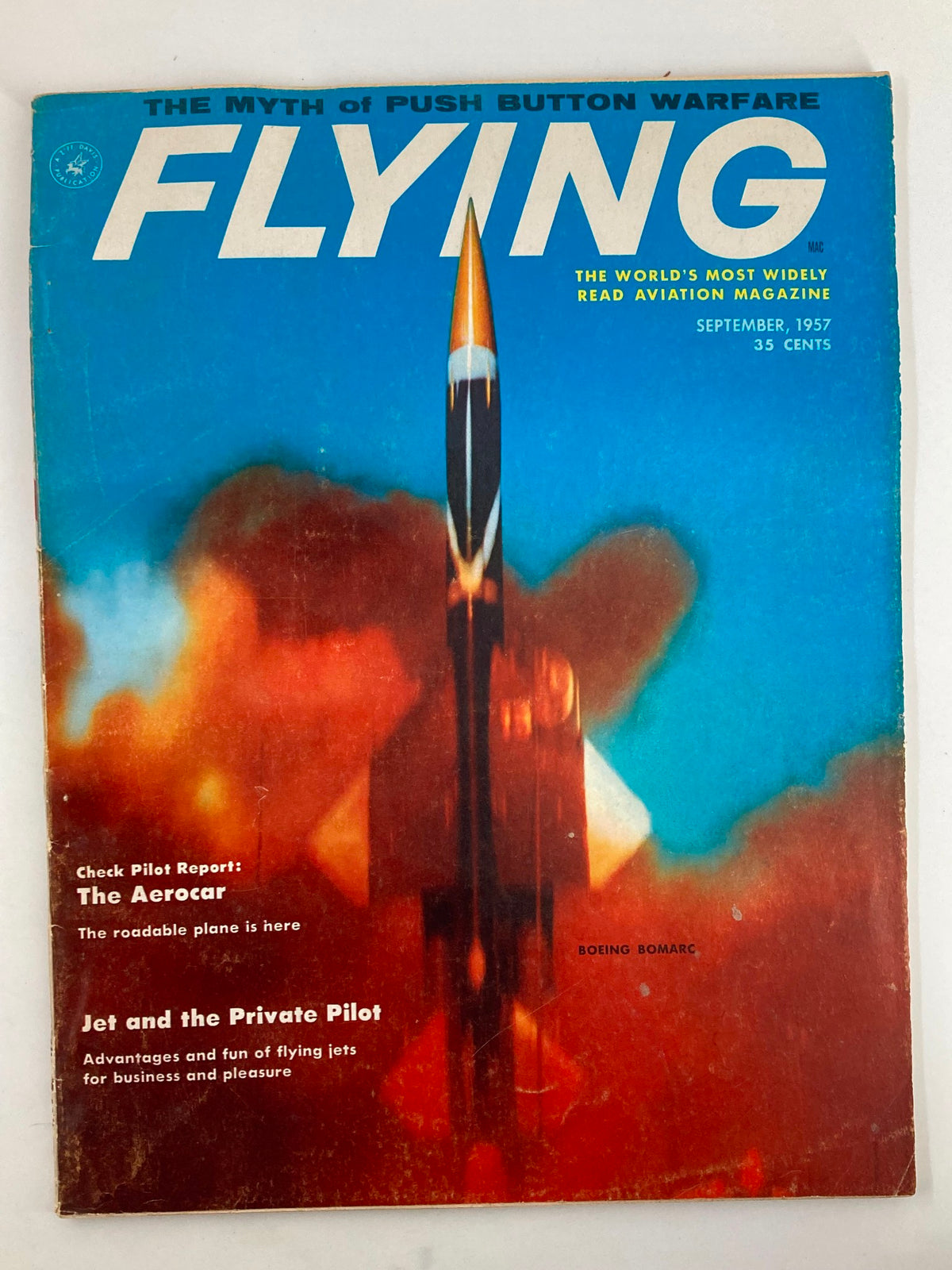 Vintage Flying Magazine September 1957 cover featuring a striking illustration of a Boeing Bomarc missile with bold graphics, symbolic of aviation advancements.